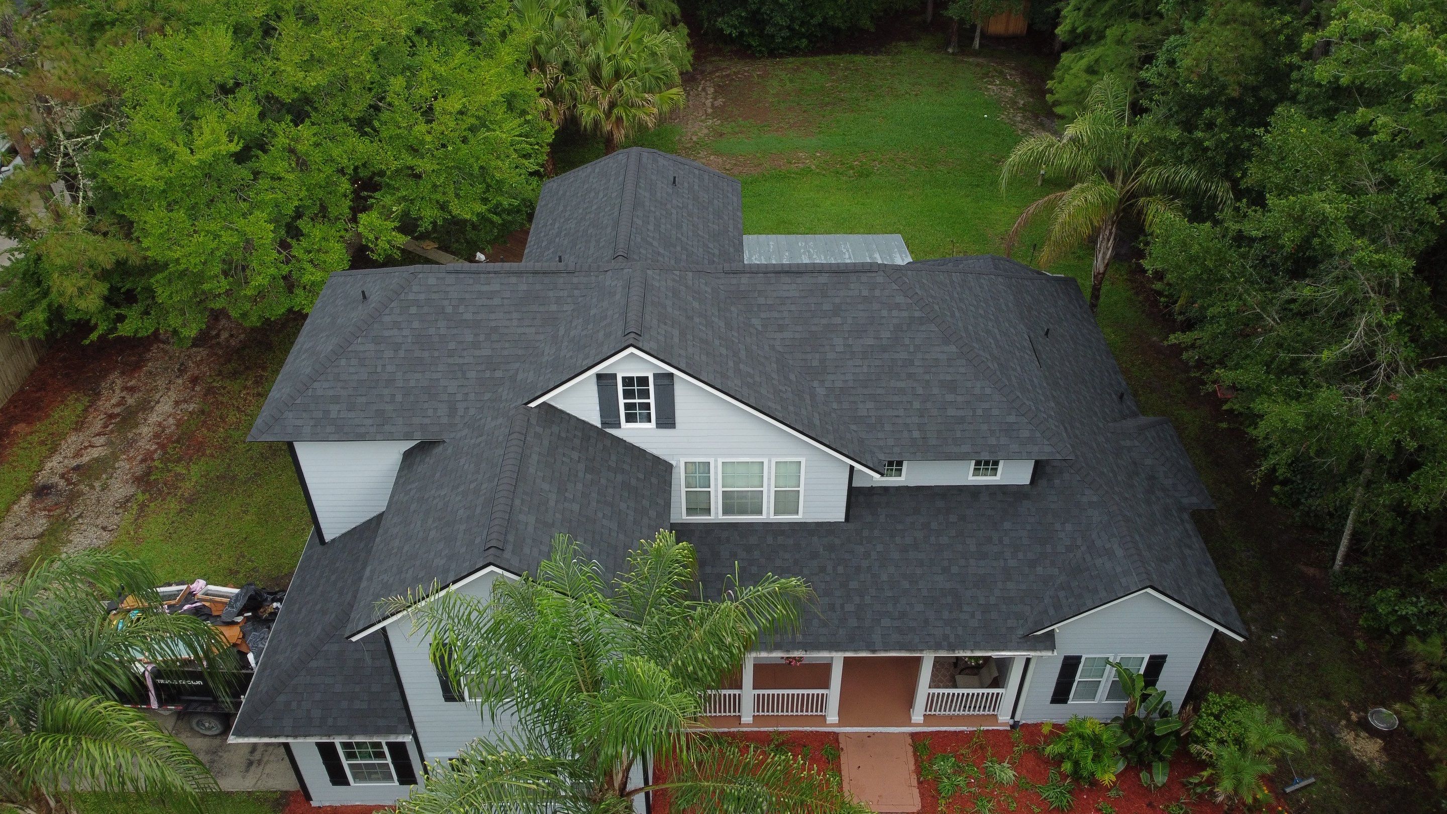 Complete Onyx Black Asphalt Shingle Roof Replacement and Skylight Installation in Jacksonville by Trinity Restoration and Roofing LLC