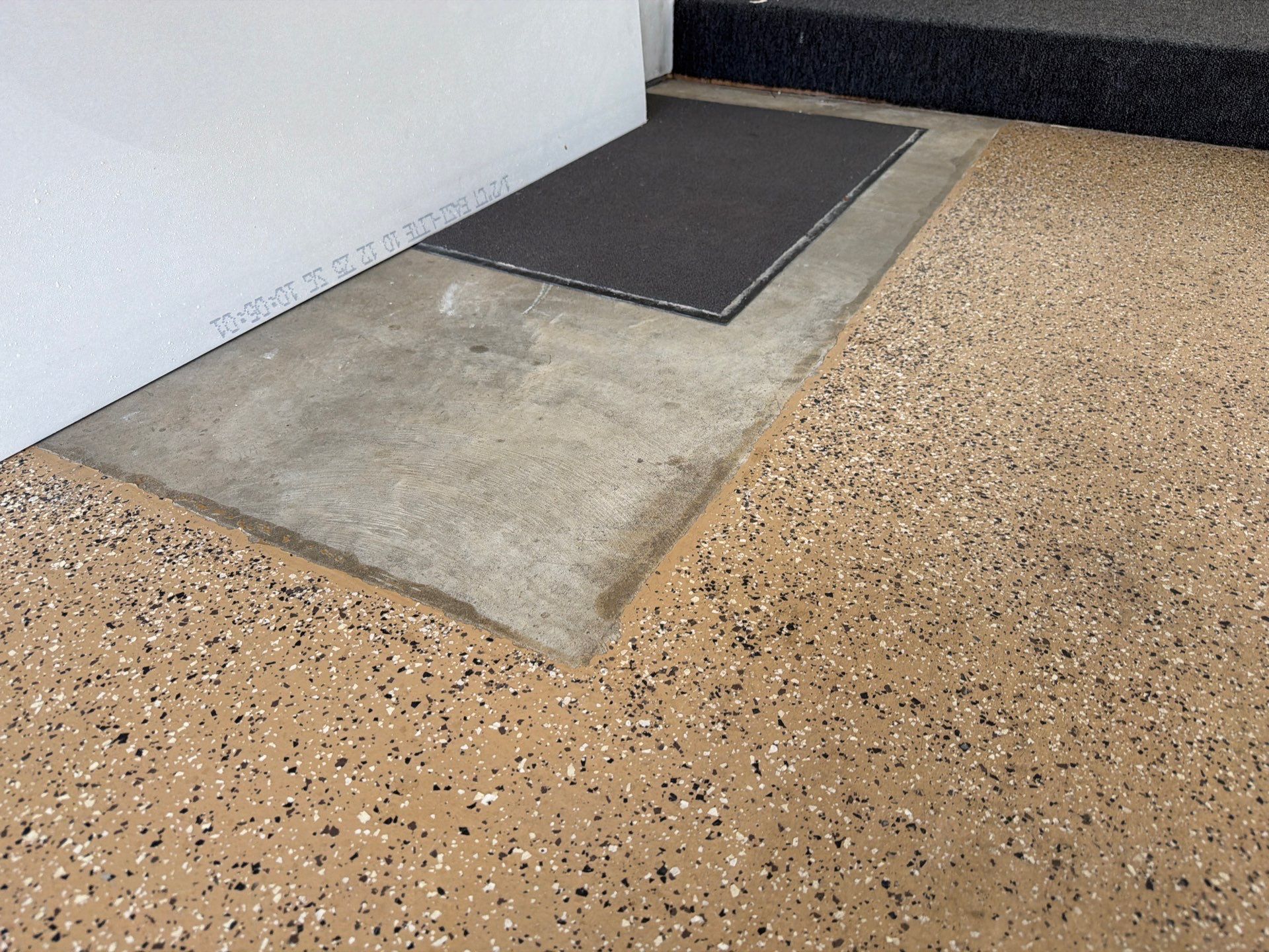 Gray Speckled Epoxy Garage Floor Coating in Sioux Falls by Select Painting, Coatings & Garage Cabinets