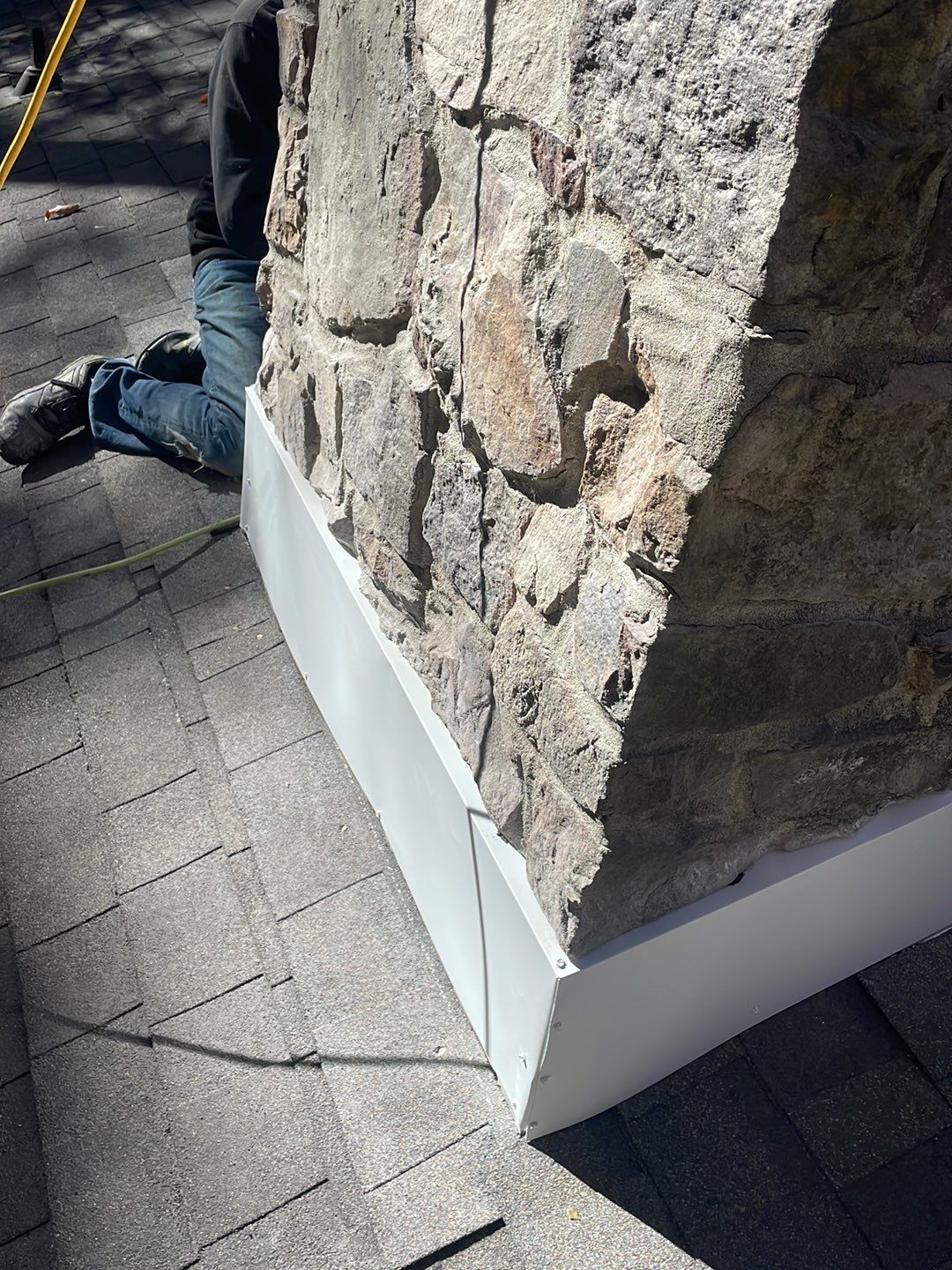 Insurance repair and chimney saddle installation. by Teflon Roofing