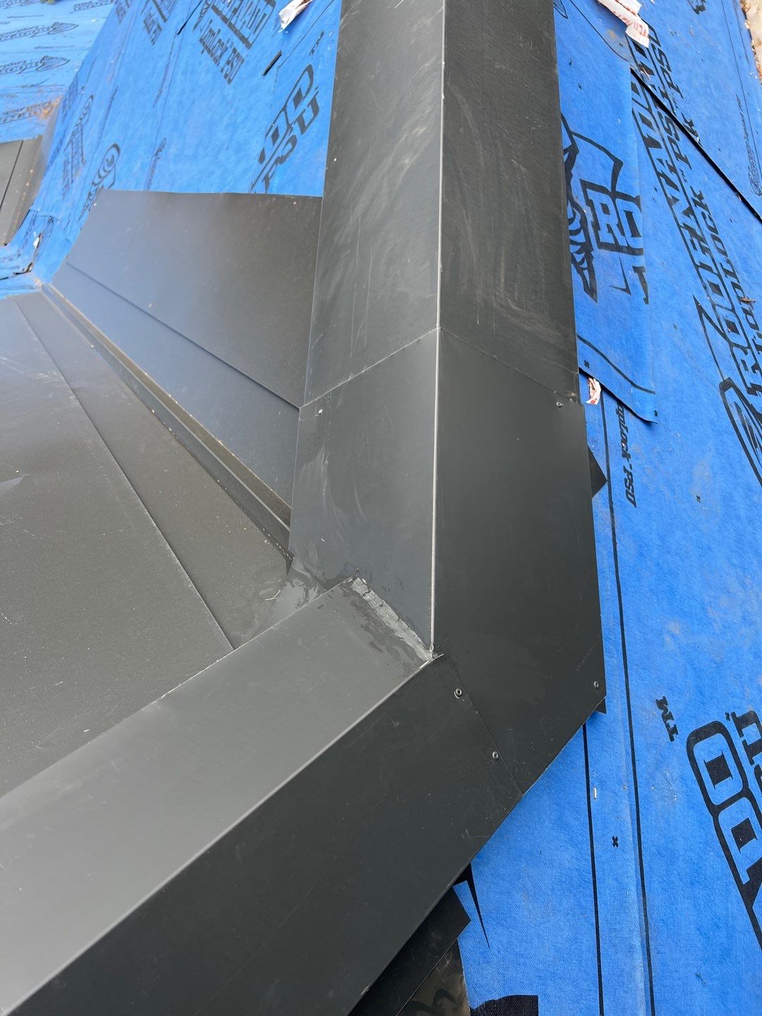 Residential Roofing Installation using 12" Prolok metal by Top Notch Roofing Inc