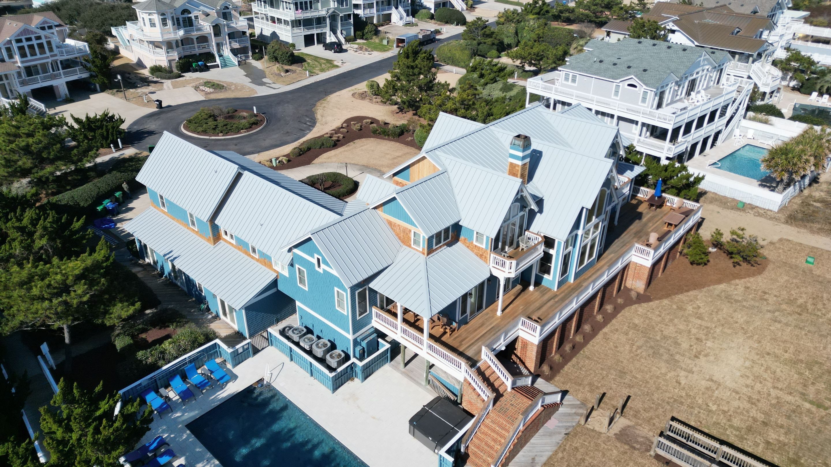 Large Metal Roof Transformation by Gallop Roofing & Remodeling, Inc.