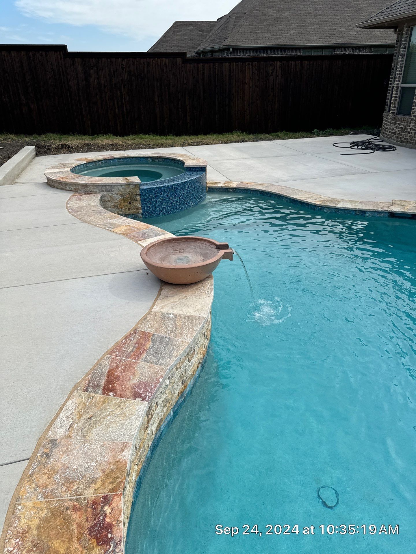 Freeform Pool with Raised Stone Spa by Pinnacle Pools and Spas - DFW