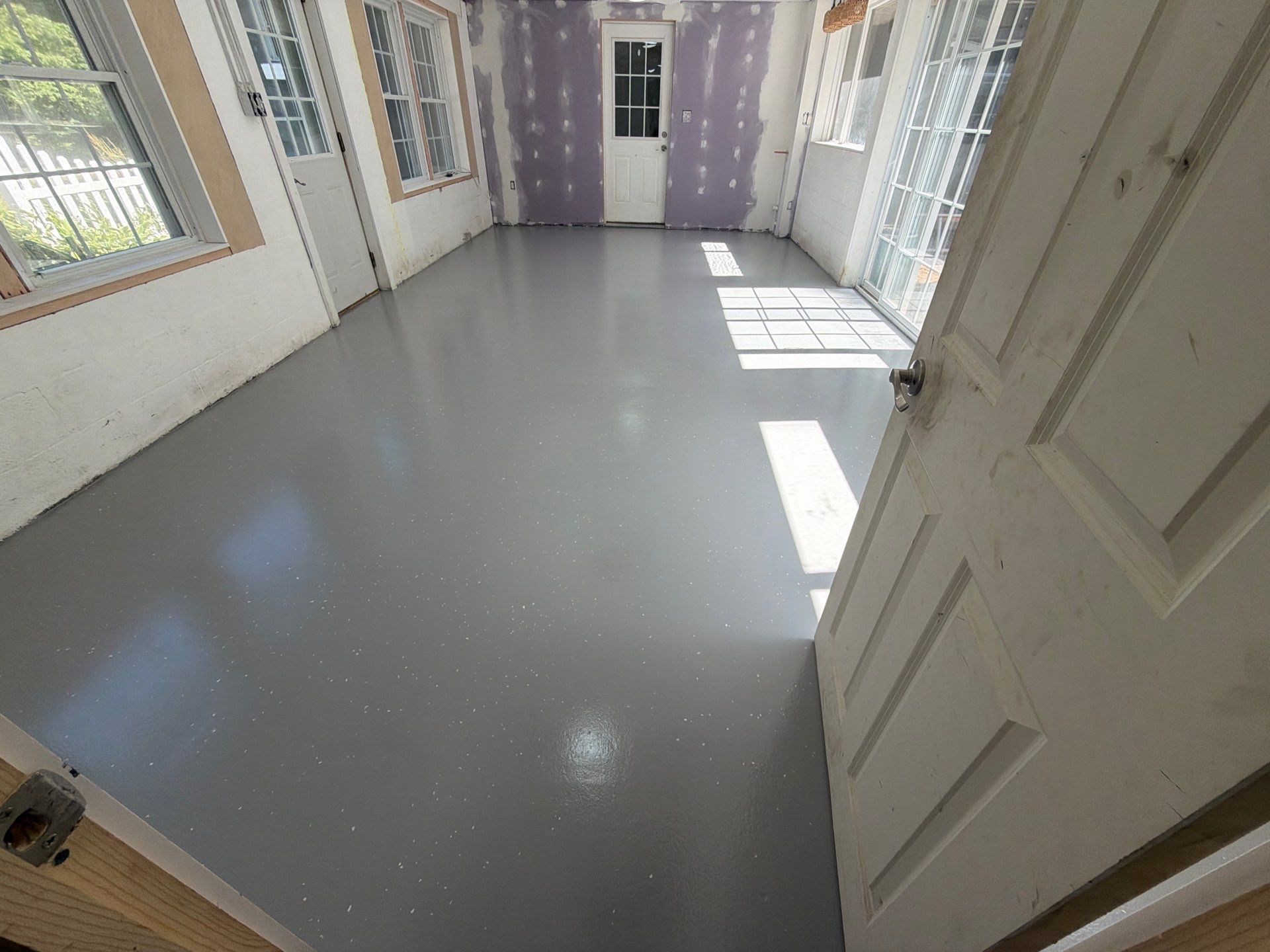 Grey Epoxy Flake Floor Installation for a Muskegon Sunroom by Gordon Painting