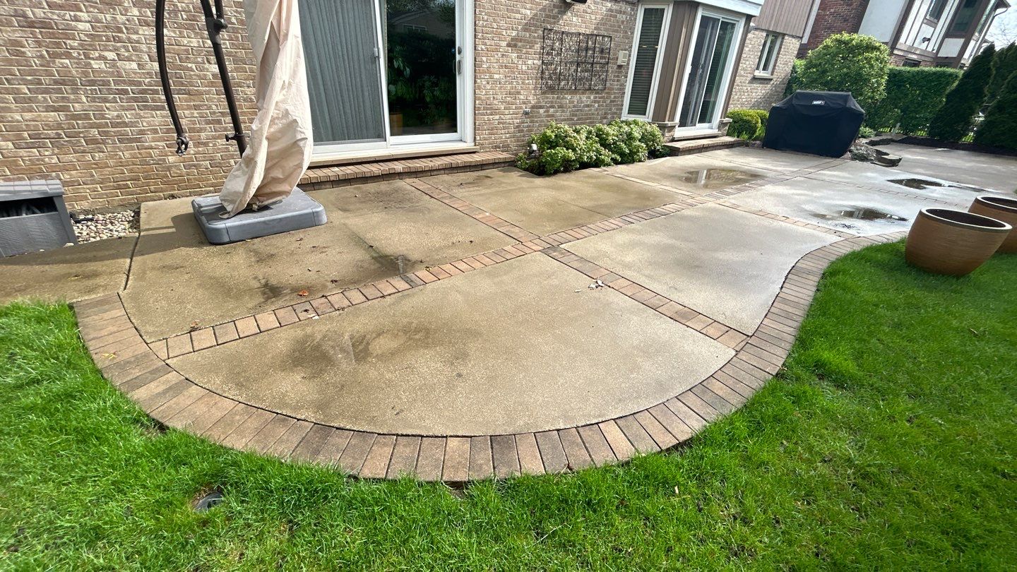 concrete patio and driveway cleaning by Northern Power Washing LLC.