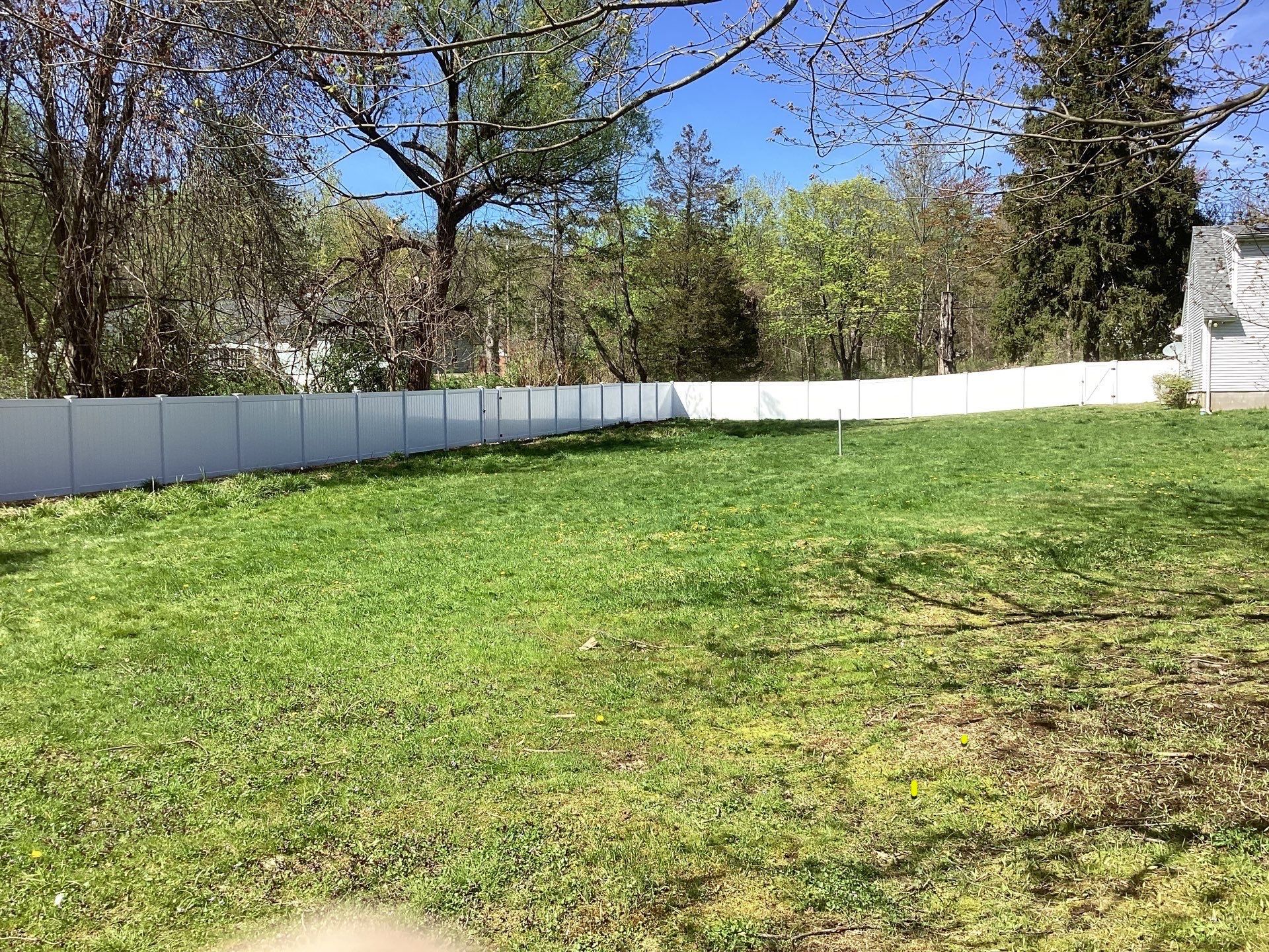 New White Vinyl privacy fence with matching gates  by DiGiorgi Roofing and Siding Inc