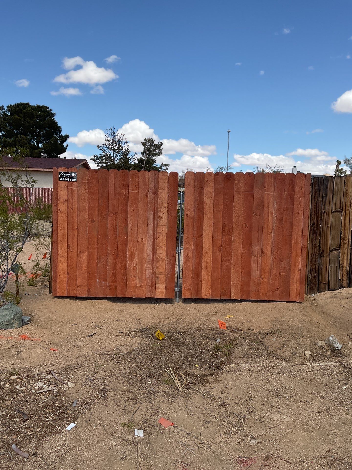 Gate installation using Wood by Fence Guys Inc. 