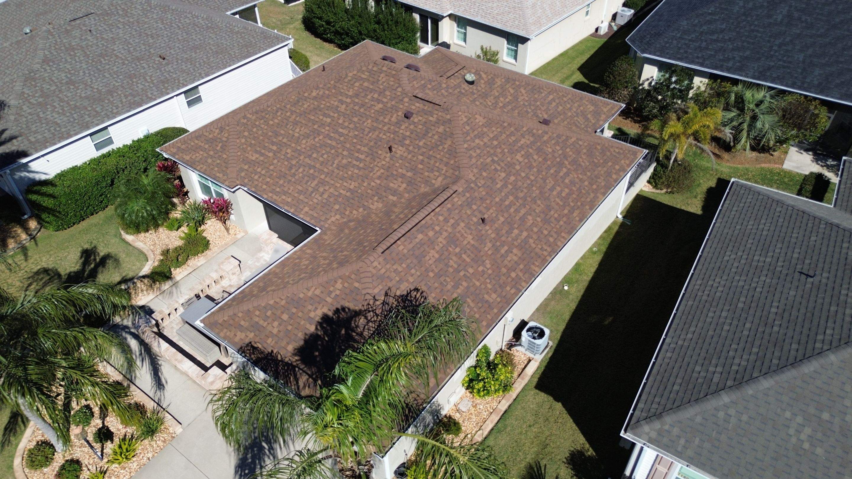 Florida roofers installing shingles by Brehm Roofing