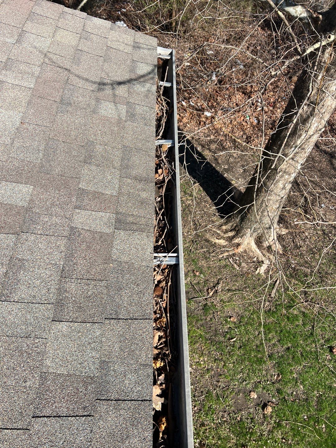 Commercial gutter cleaning Avon, IN before photo with filled gutters