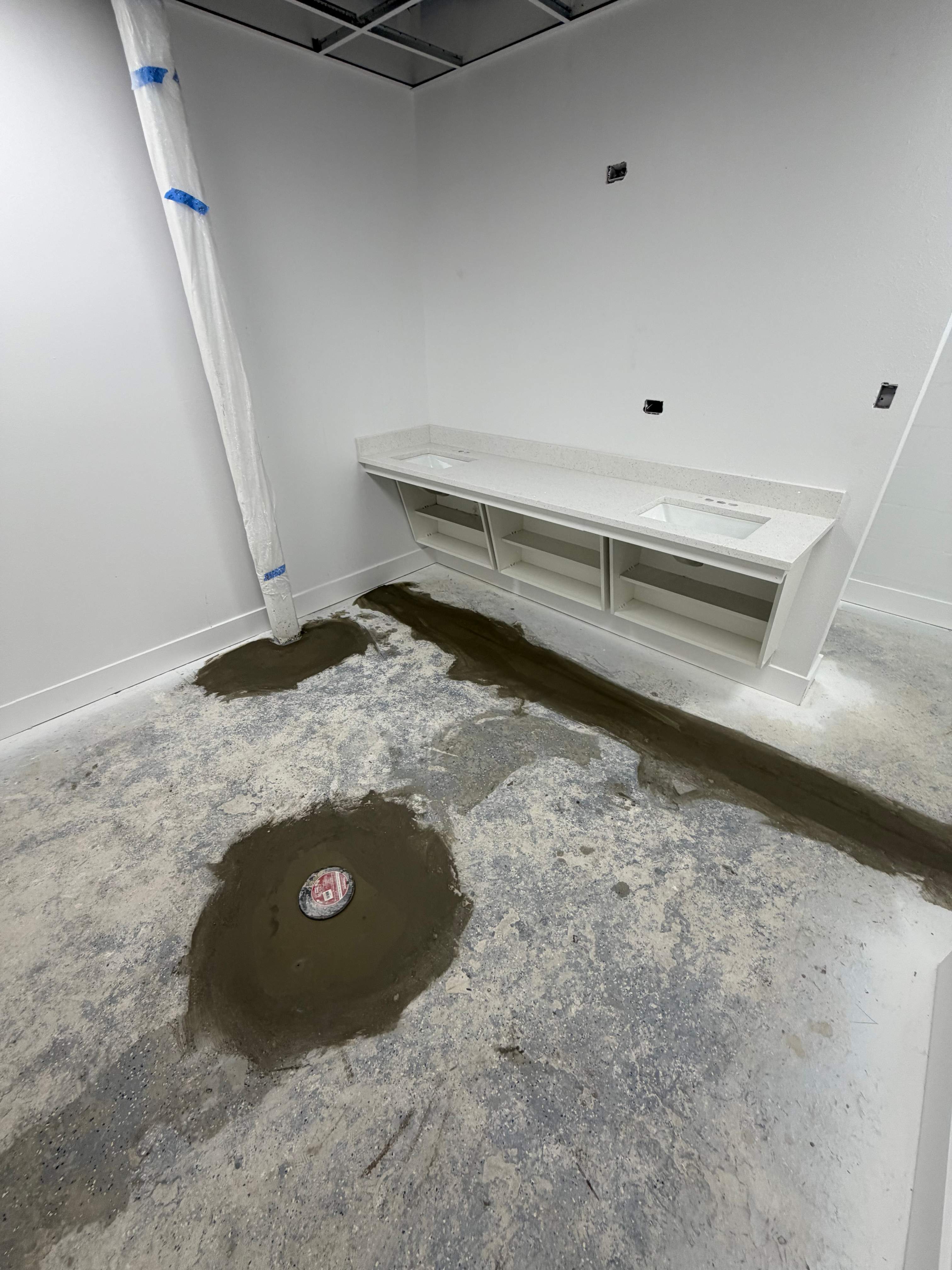 Commercial Restroom Renovation with Epoxy Flooring in Sarasota by Vertical General Contracting 
