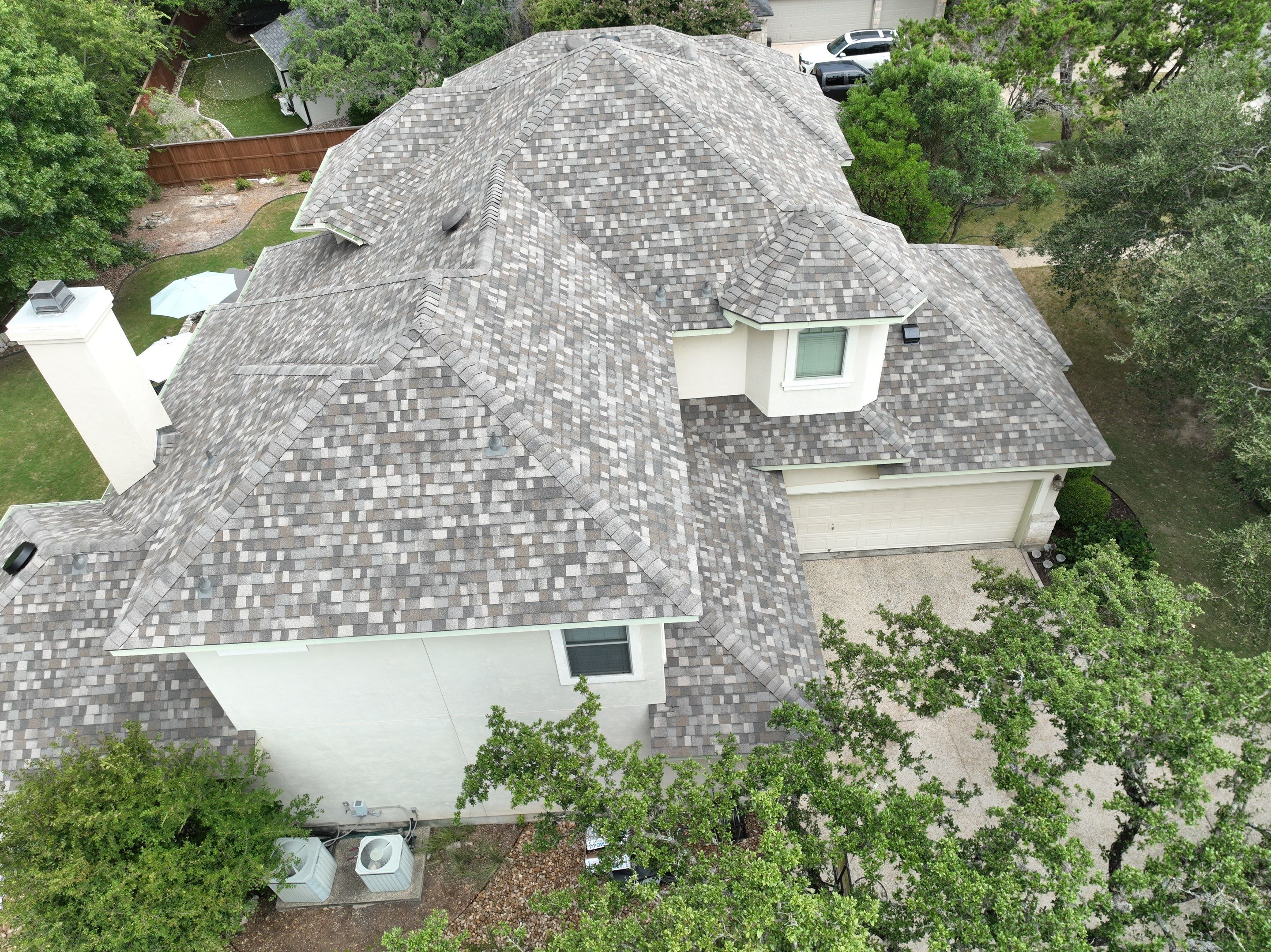 Residential Roof Replacement using 30 Year Laminate Shingles with High Profile Ridge by Premier Roofing and Contracting