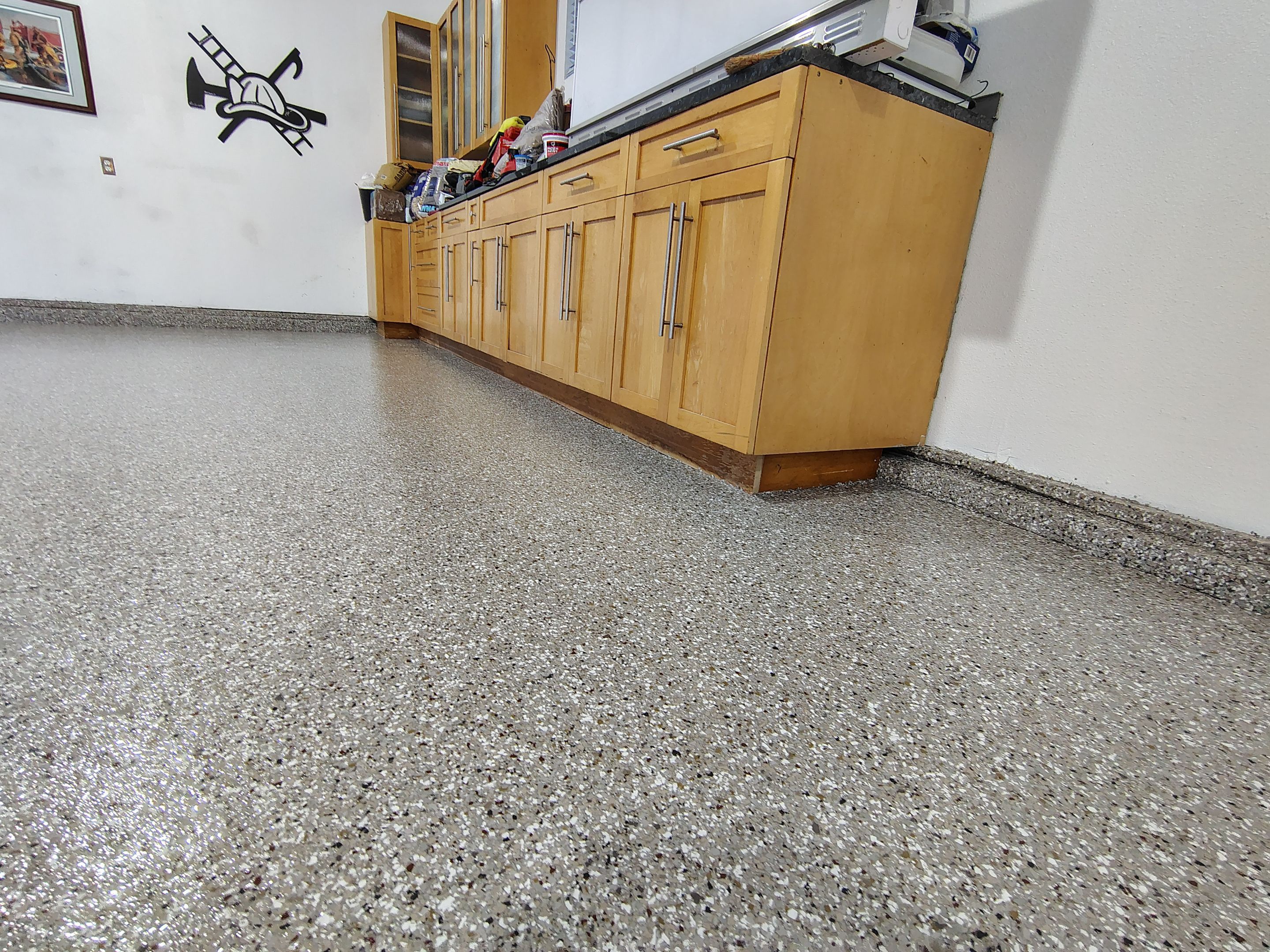 Garage Floor and Entry Step Concrete Coating in Sioux Falls by Select Painting, Coatings & Garage Cabinets
