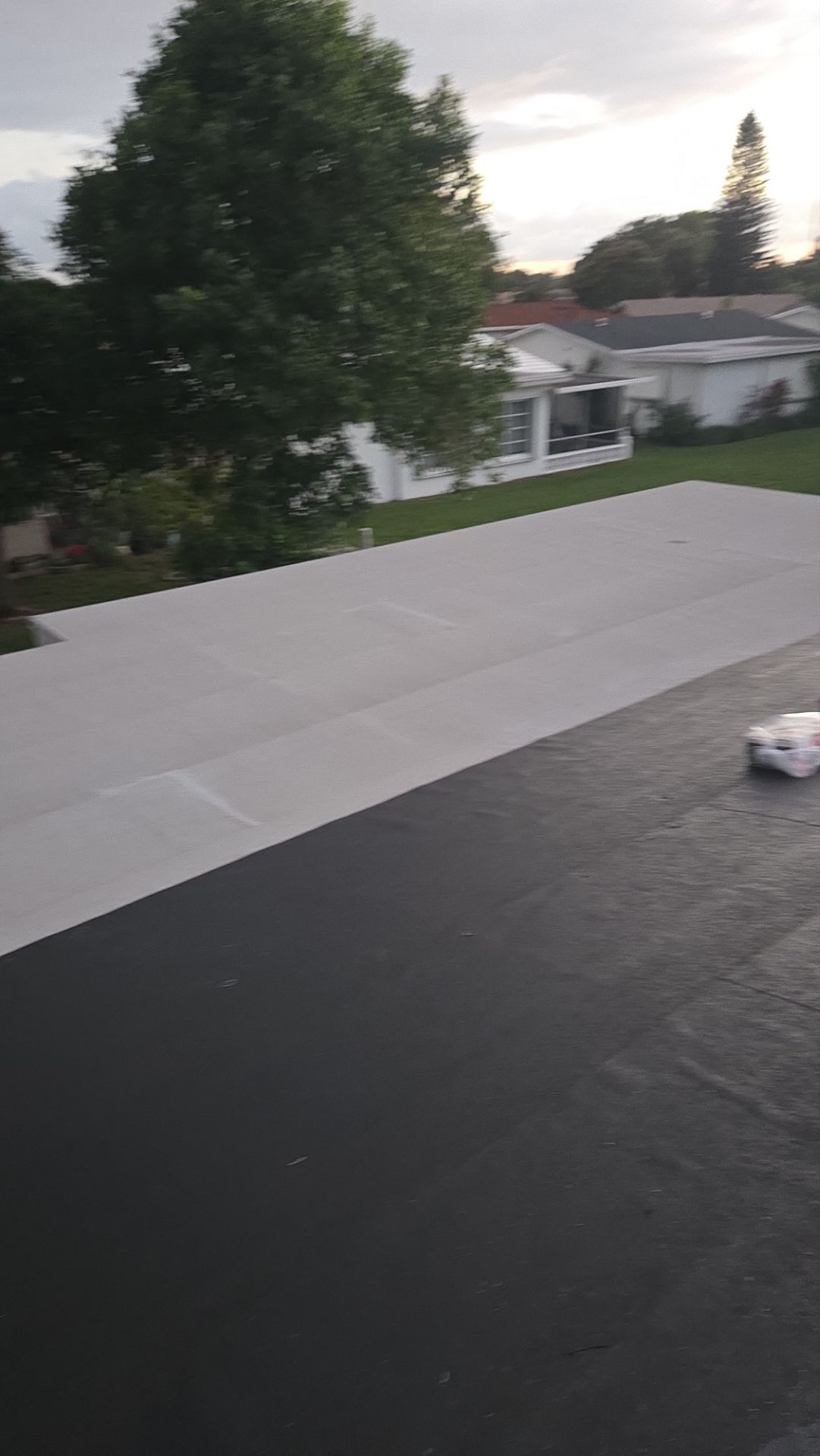 Silicone install-- Flat roof by Aastro Roofing