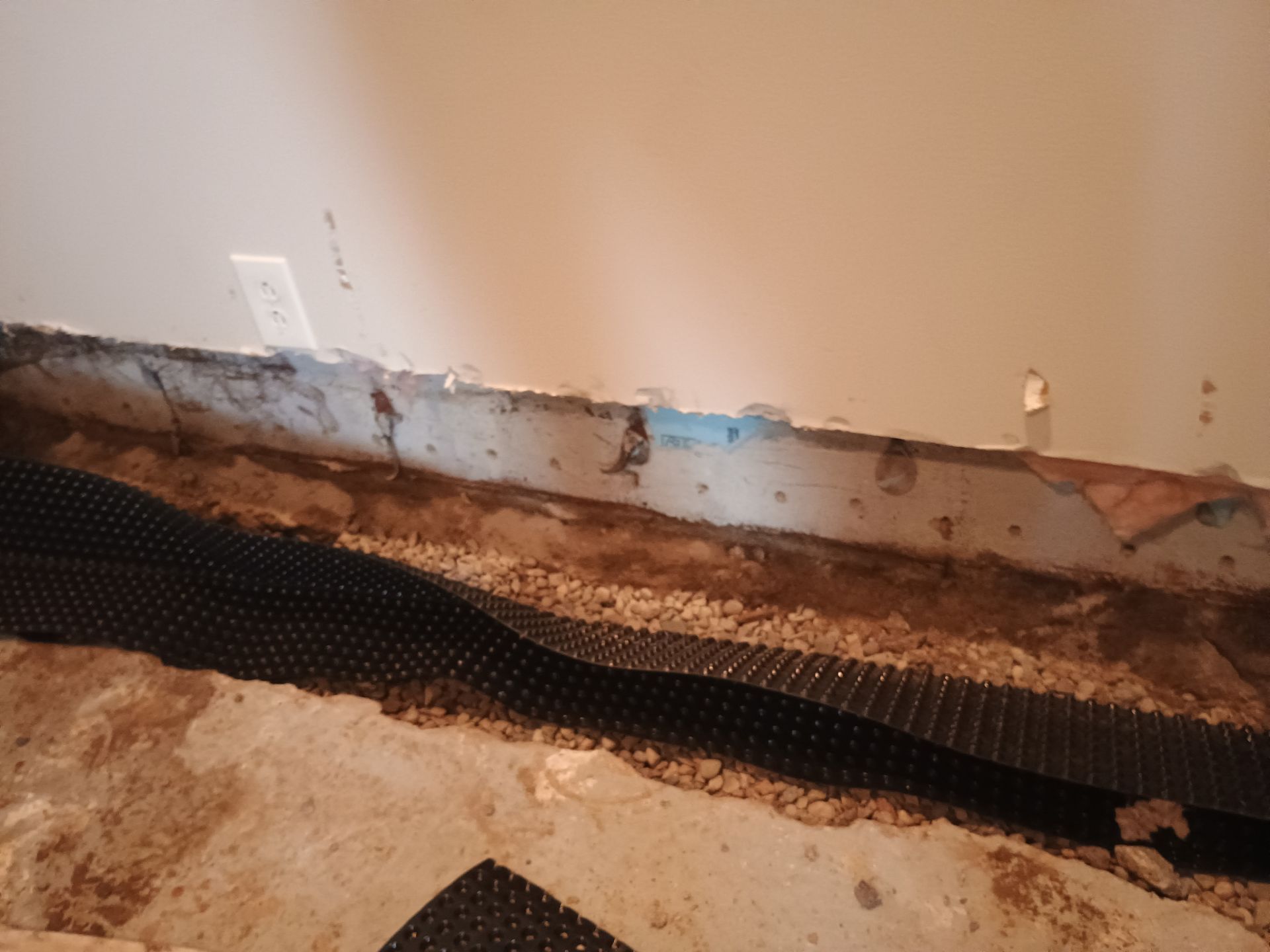 Interior Drain Tile in a Finished South Minneapolis Basement by Waterproofing Northeast