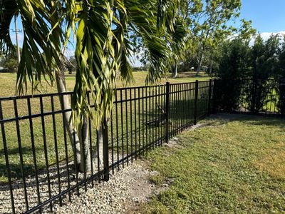 Aluminum Fence Installation using 3 Rail 4Ft Black Aluminum and 4Ft White Vinyl Fence