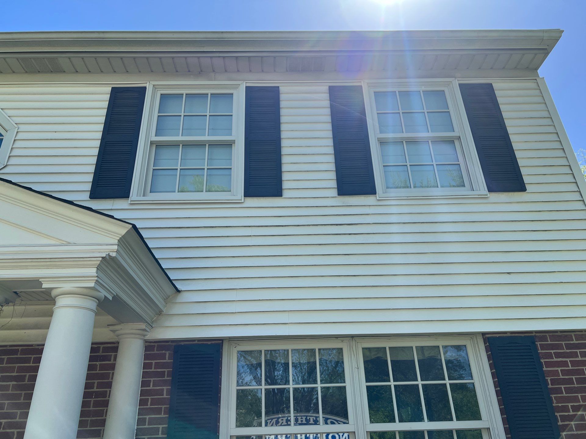 Housewashing  using Algaecide, soft wash soap by Northern Power Washing LLC.