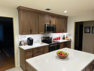 Stone Oak Kitchen Remodel Removing Wall to Expand Space