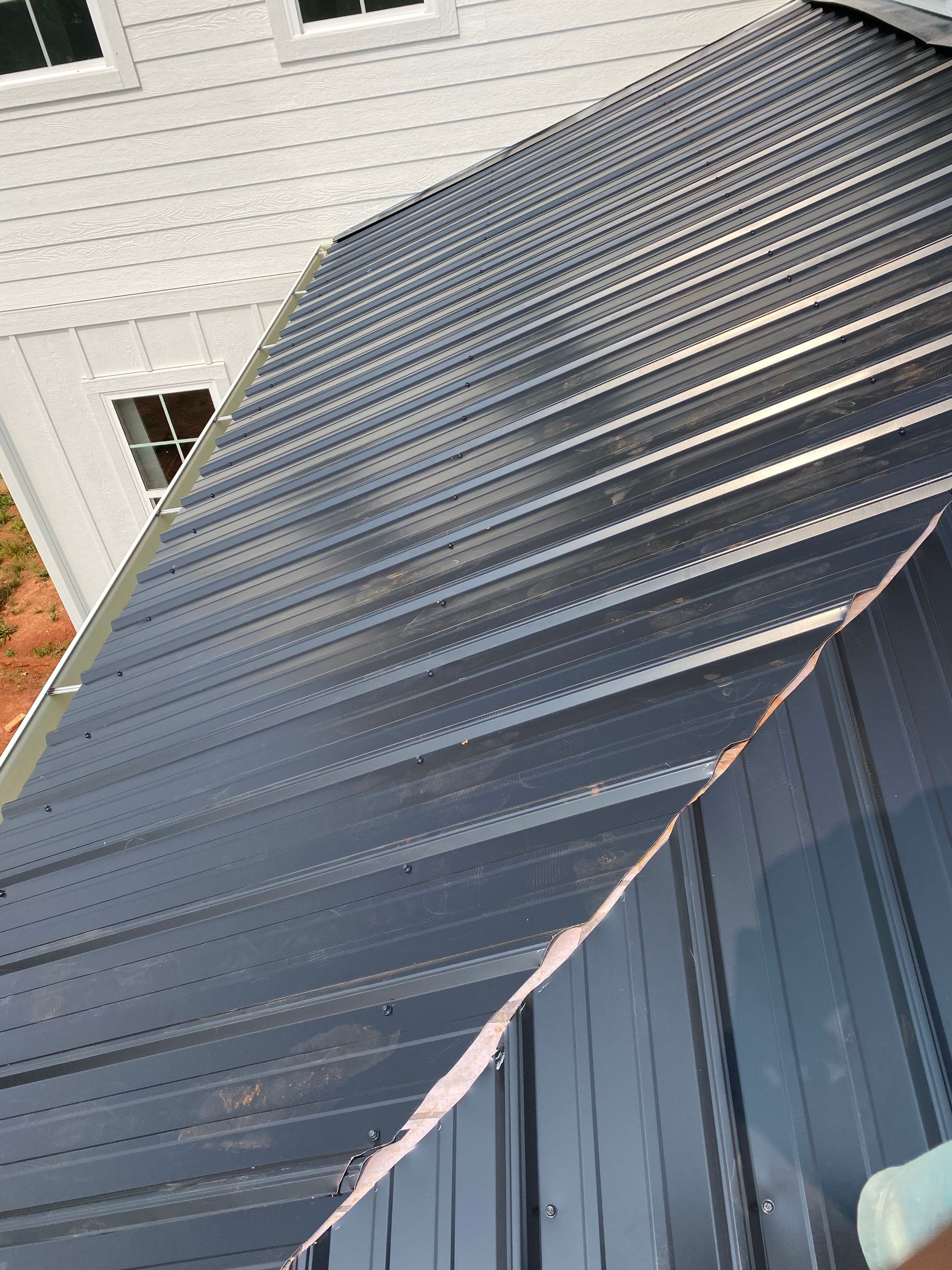 Jason's metal porch roof by BROCK BUILDERS 