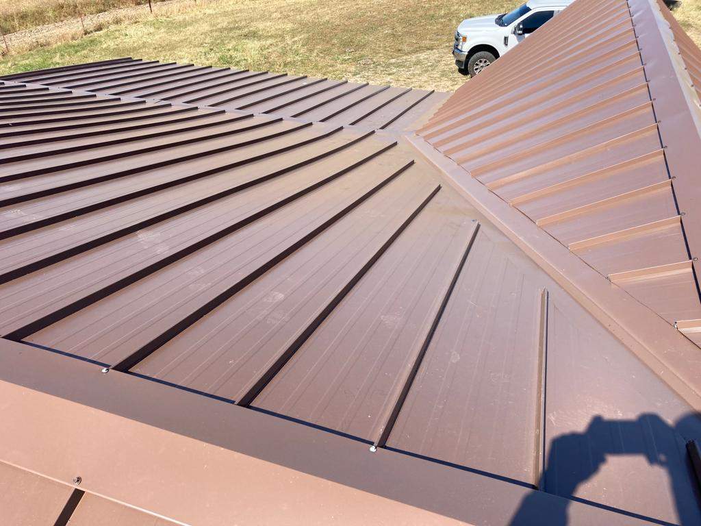 Metal roofing installation using Standing seam metal roofing system by Straight Edge Roofing Inc