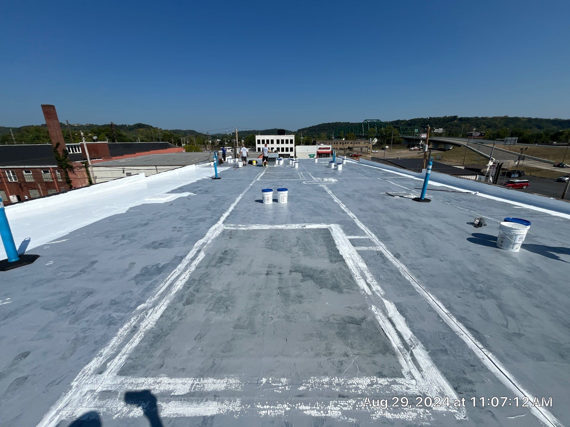 Commercial Roofing Installation using smartcoat Roof coating by Fahey Roofing + Contracting