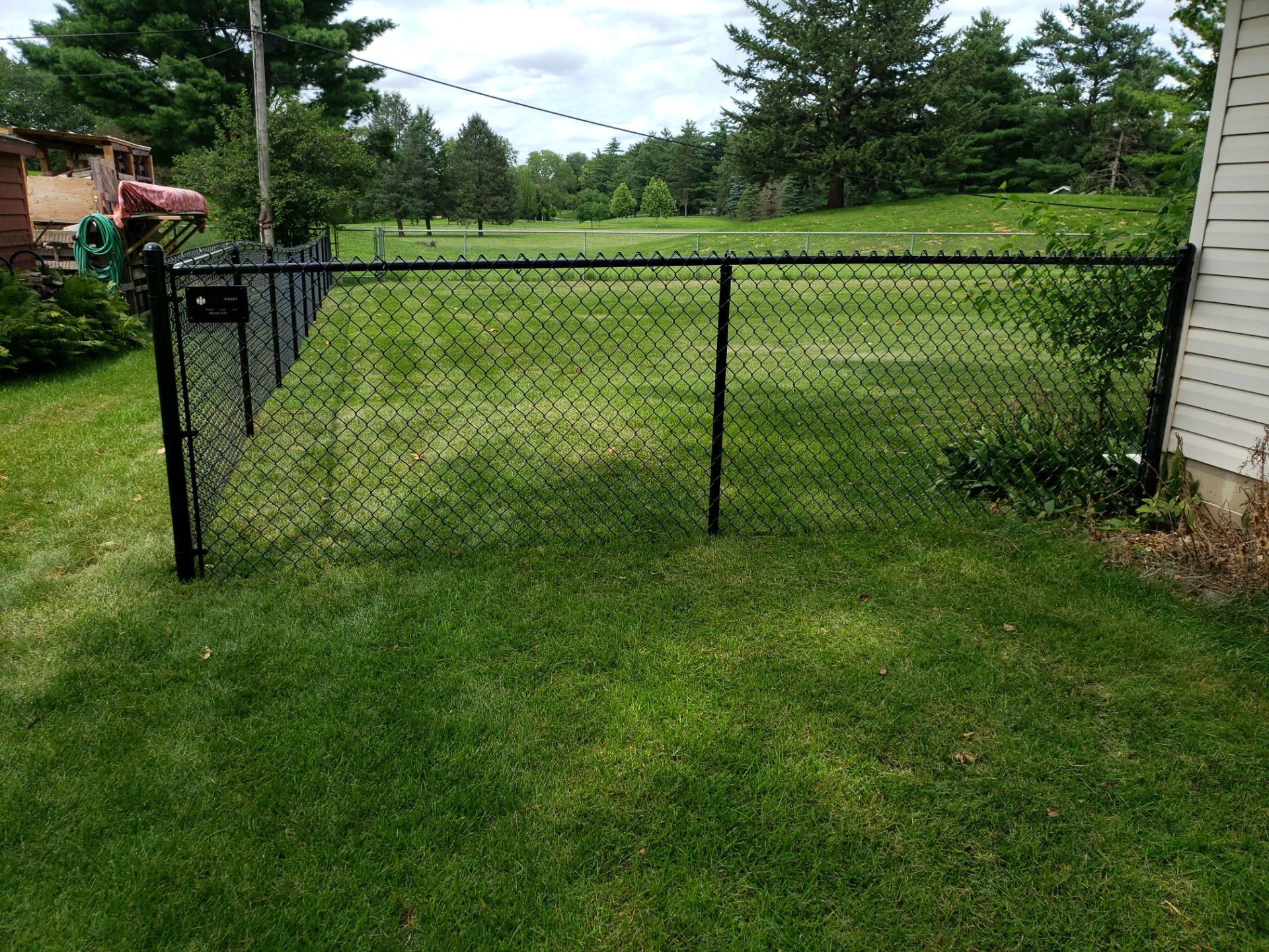 Black Chain Link Fence Installation in Cedar Falls by Perfect Picket Fence and Stain