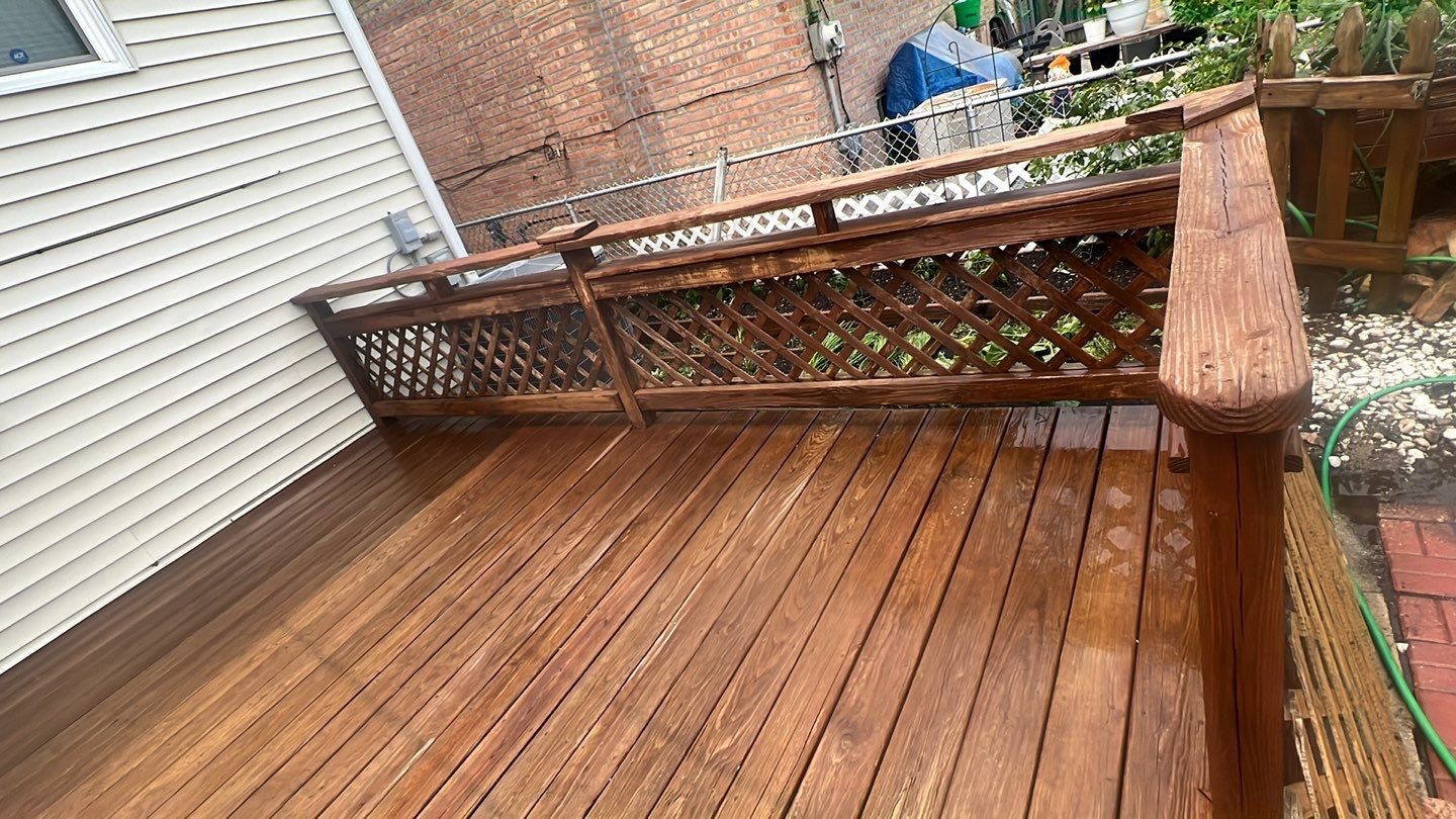 Wood cleaning and staining using Armstrong cloark oil stain by Northern Power Washing LLC.