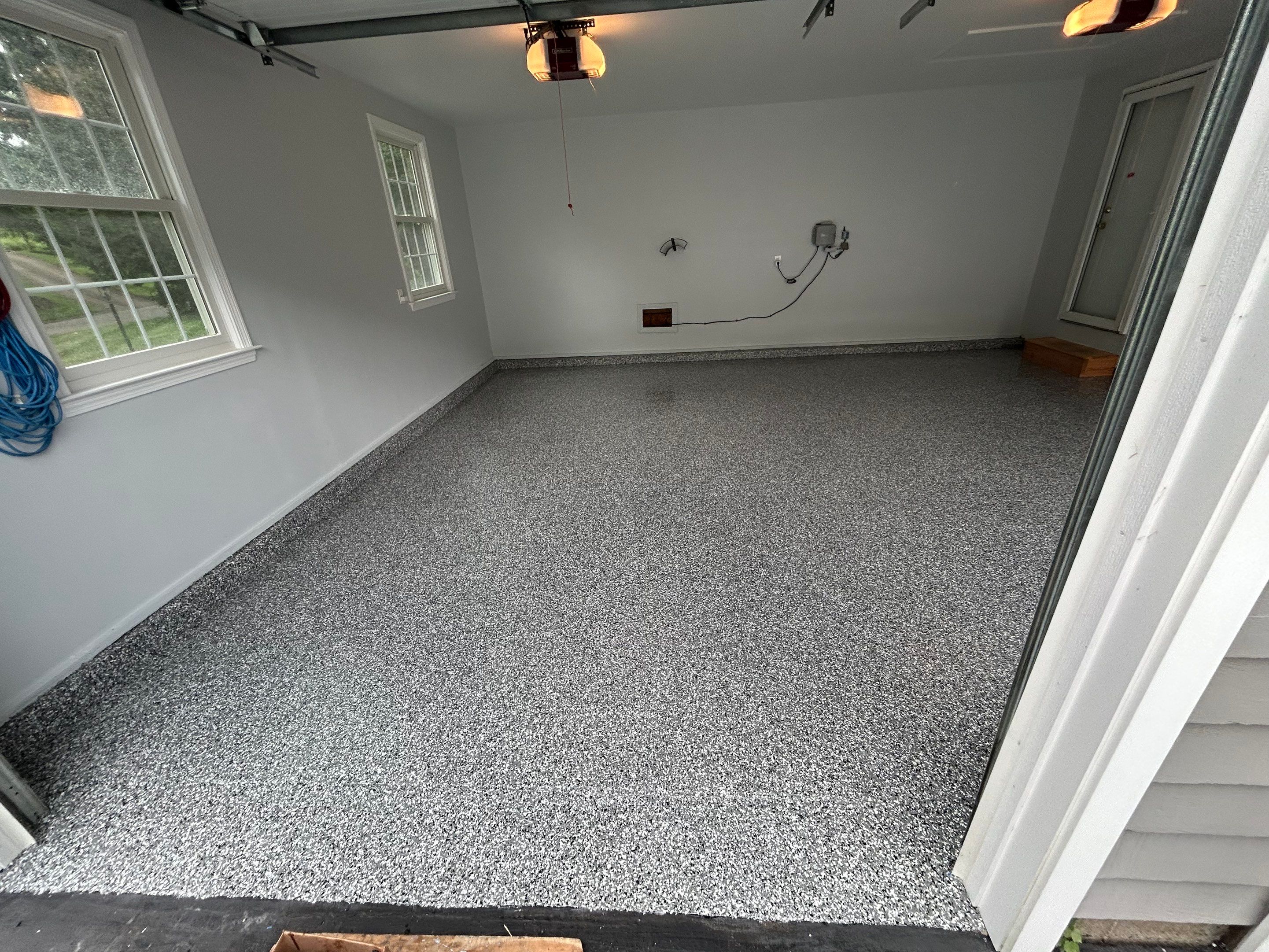 Wombat Concrete Floor Coating Transformation by DiGiorgi Roofing and Siding Inc
