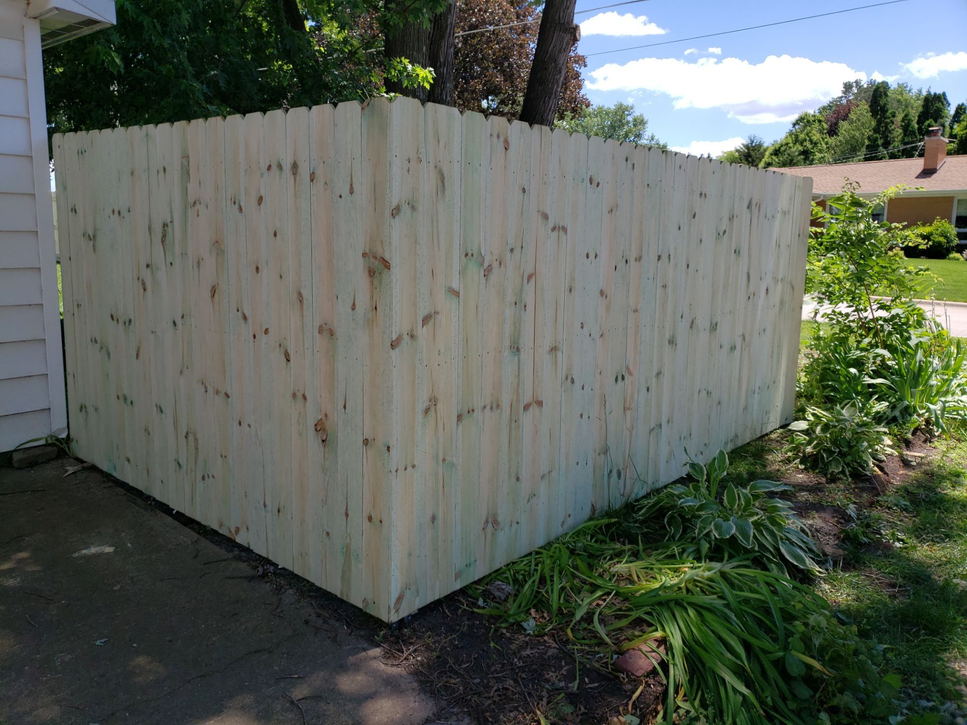 Pressure-Treated Pine Privacy Fence Replacement in Waterloo, Iowa by Perfect Picket Fence and Stain