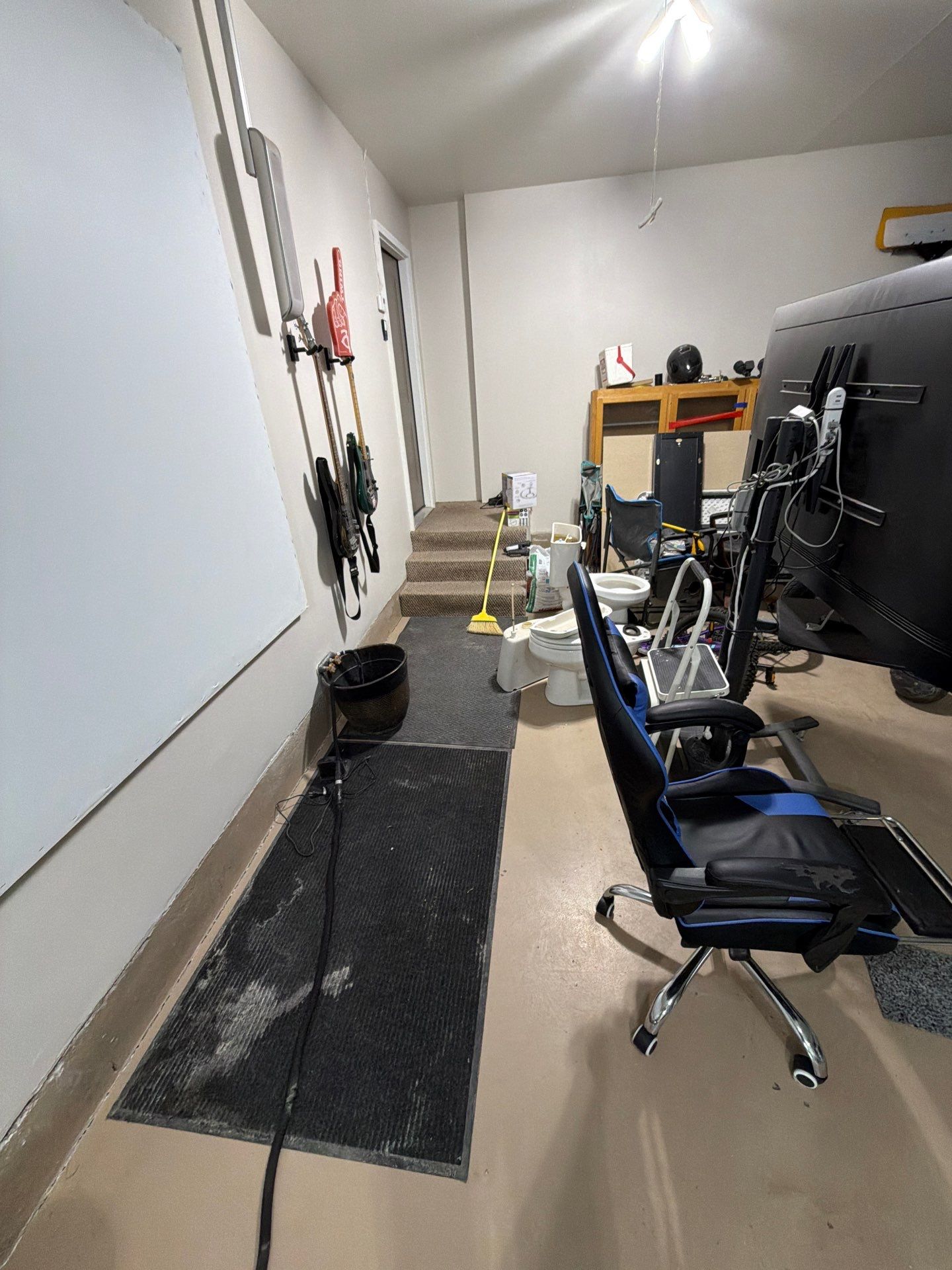 Residential Garage Floor Coating with Grey Speckled Epoxy Finish by Select Painting, Coatings & Garage Cabinets