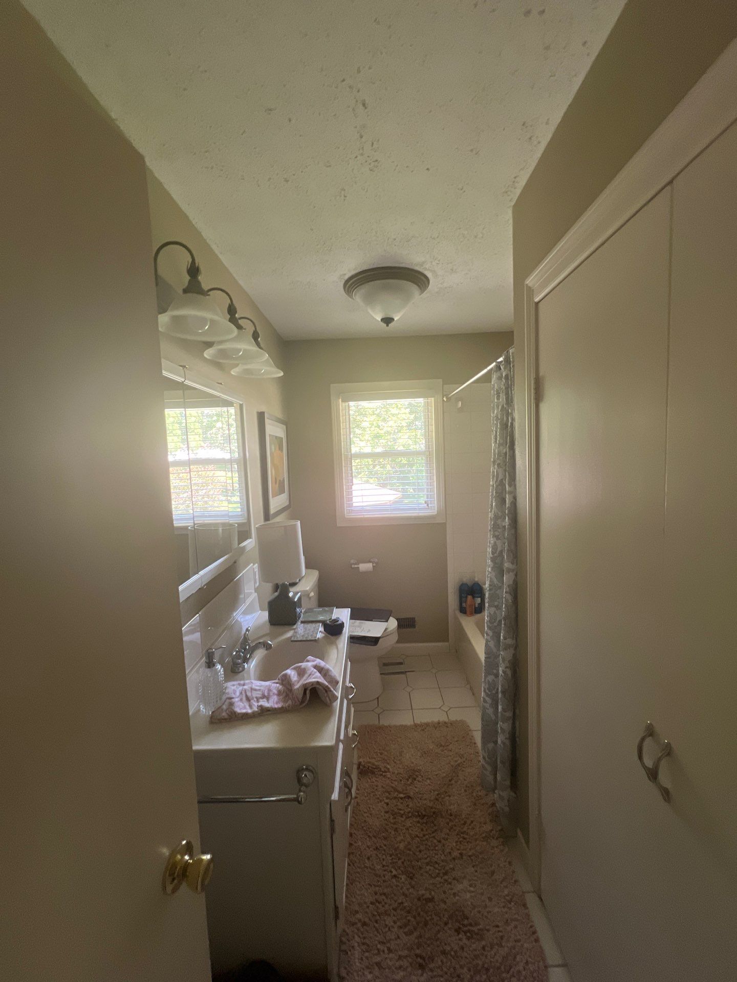 Full bathroom with custom tile by The Shower Company