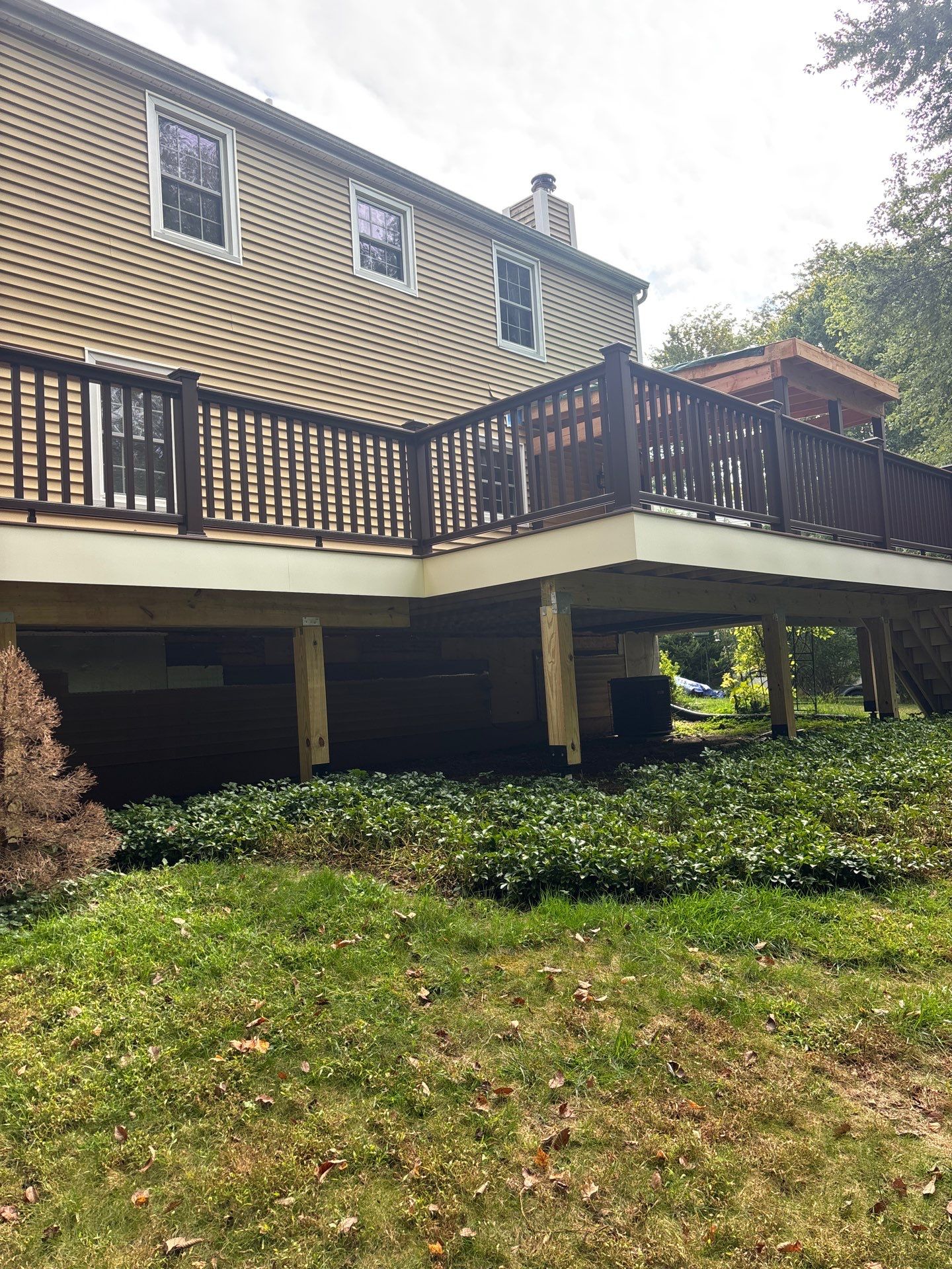 Deck and Screened in room replacement with Trex Saddle and vintage lantern railings by DiGiorgi Roofing and Siding Inc