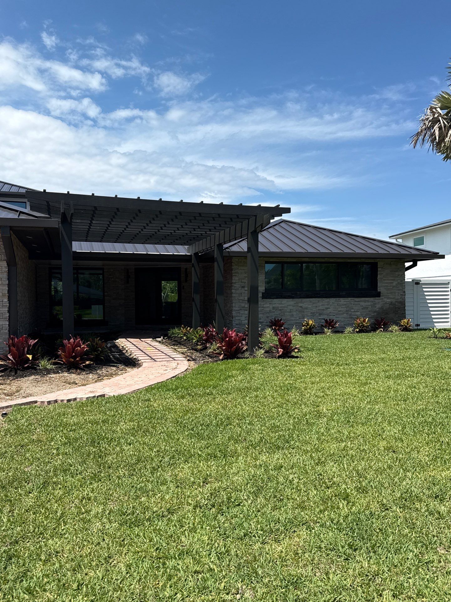 7-Inch Smooth Box Seamless Gutters using black seamless gutters in Siesta Key Fl by Gutter Professors