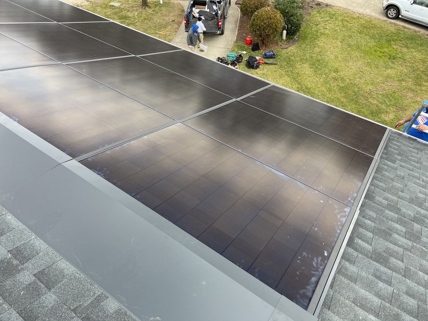 Roof Replacement with GAF Decotech integrated solar panels by American Home Contractors