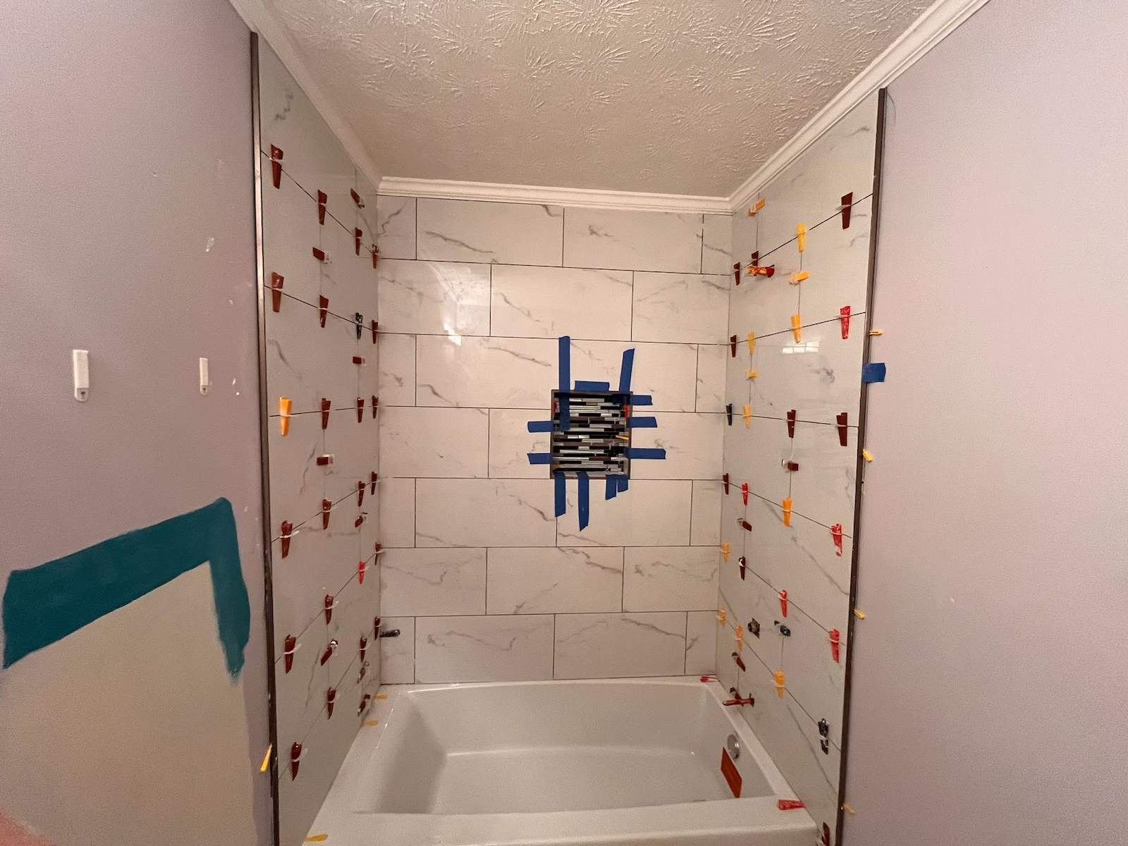 Guest bathroom tub and flooring by Prudencio