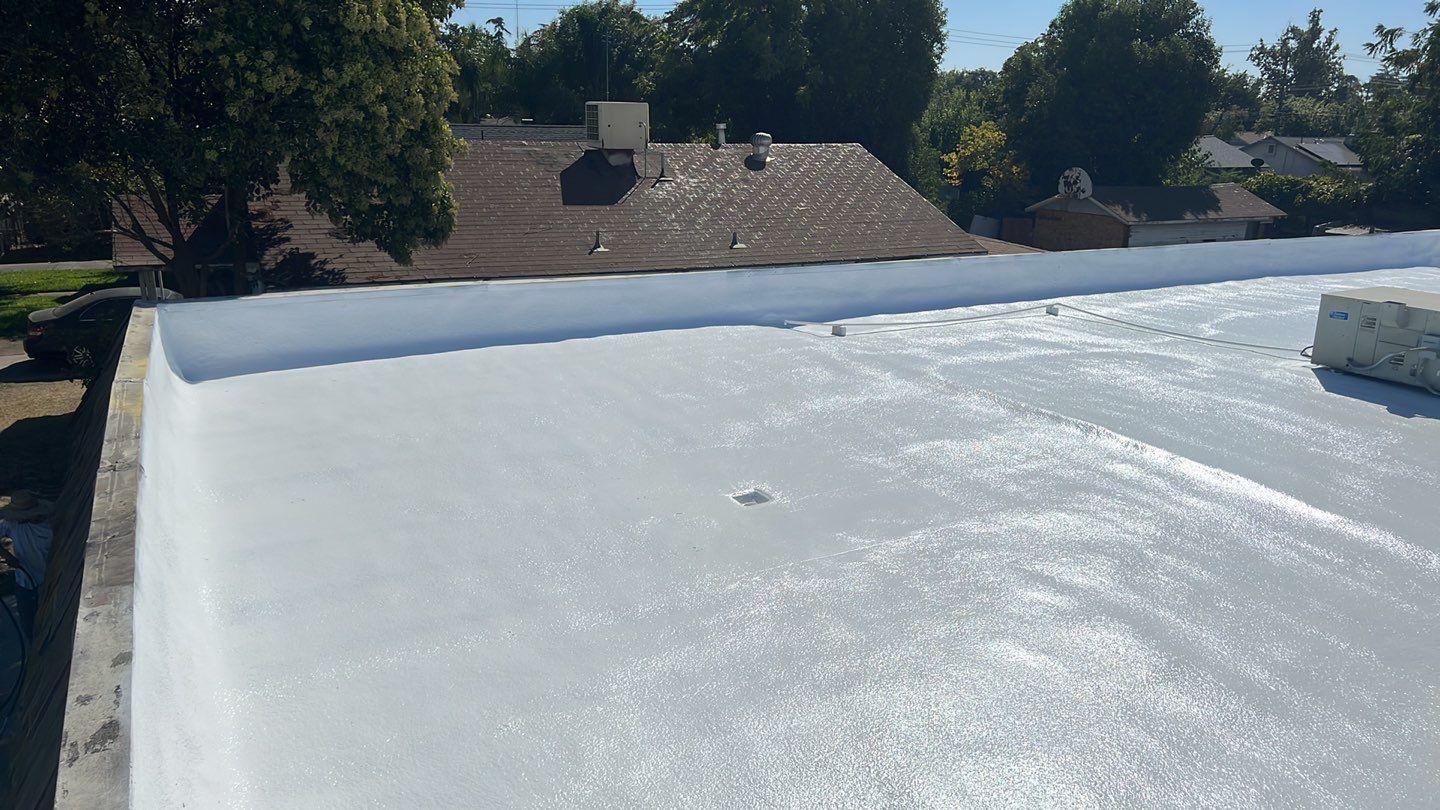 Foam Refurbish using Conklin Benchmark/PUMA XL coatings and spray foam; Also metal roofing around parapet wall by Straight Edge Roofing Inc