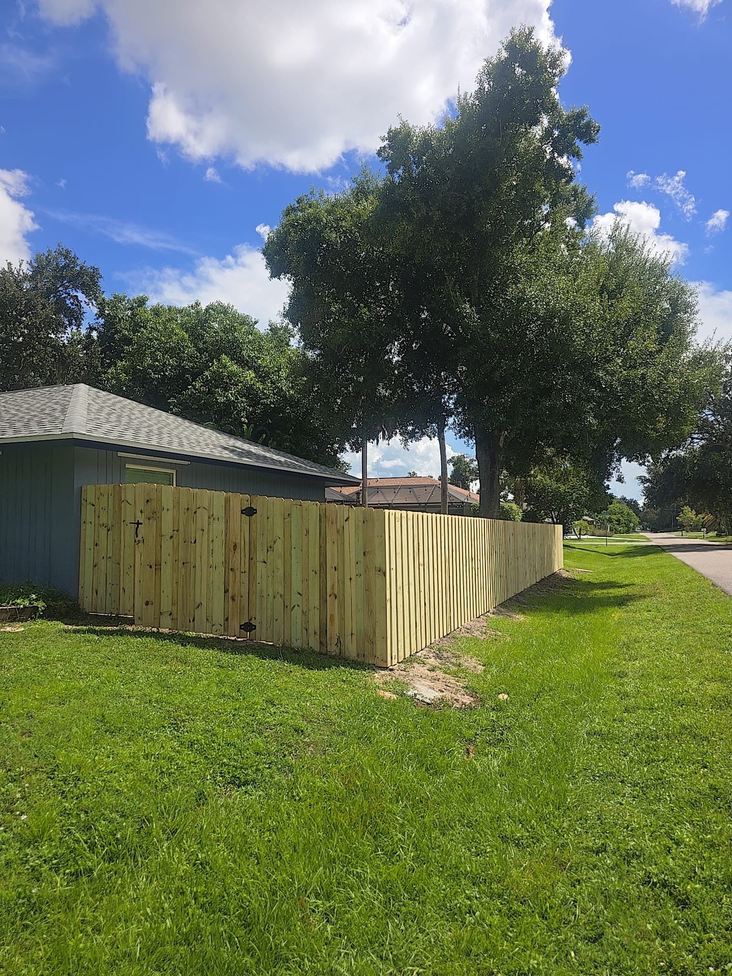 Wood Privacy Fence Installation with Double Gate in Port Charlotte by True Fence LLC