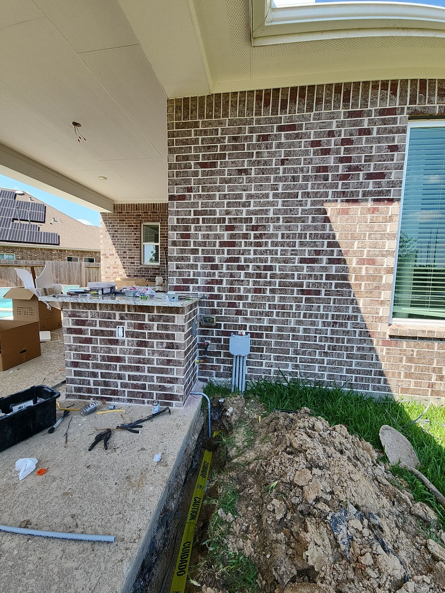 Covered patio and Summer Kitchen in Spring, TX by SophAlx LLC