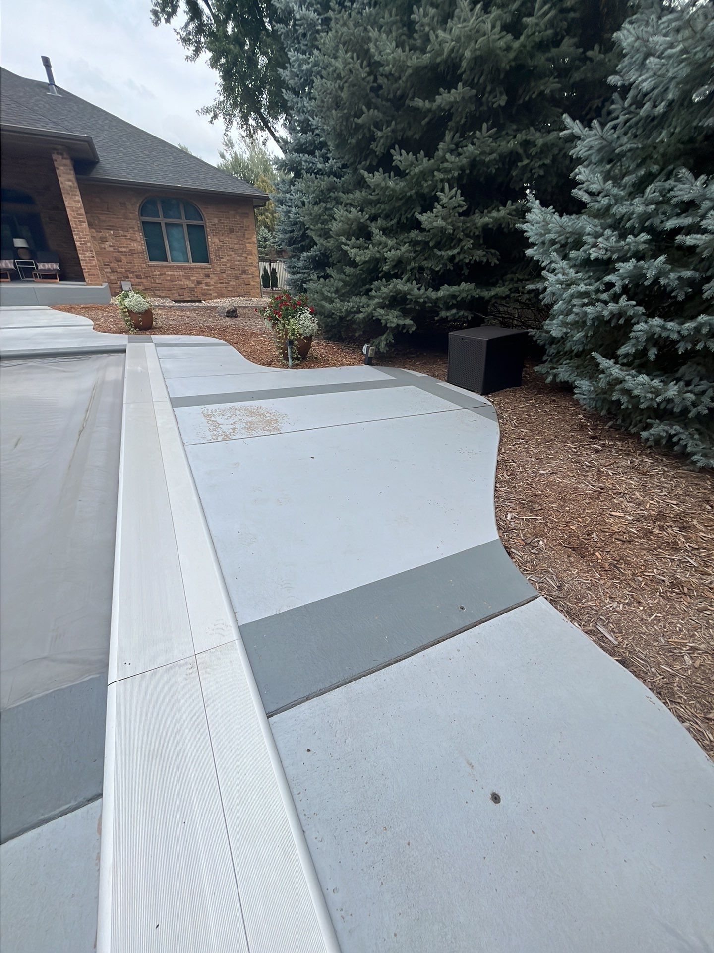 Decorative Concrete Pool Deck and Patio Resurfacing in Sioux Falls by Select Painting, Coatings & Garage Cabinets