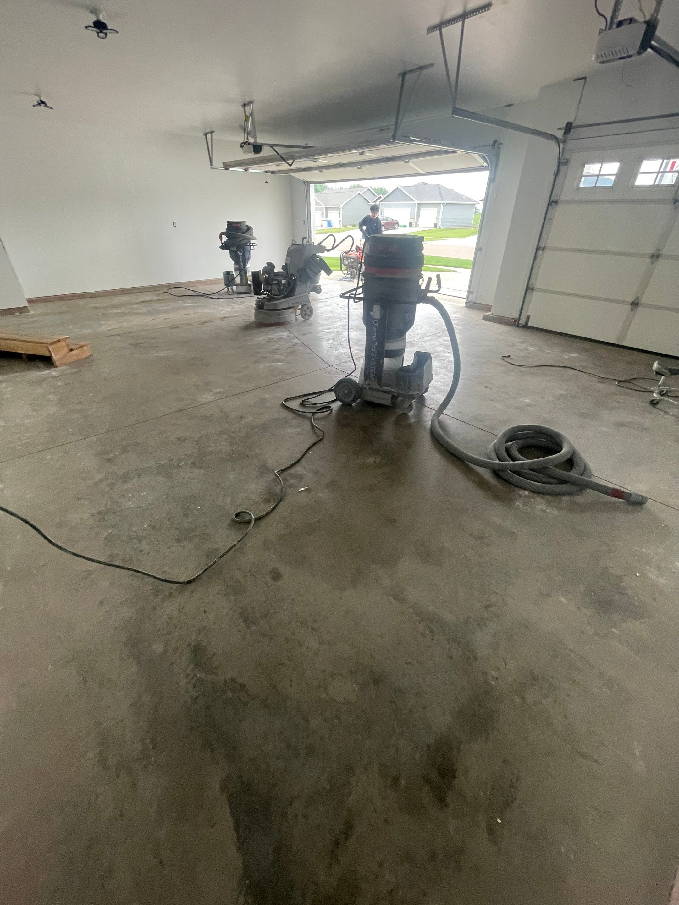 Grey Flake Epoxy Garage Floor Coating in Sioux Falls by Select Painting, Coatings & Garage Cabinets