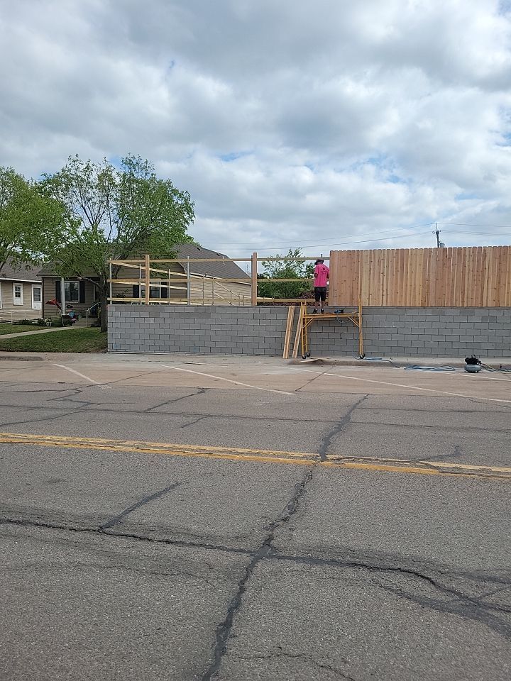 Cedar Fence using Cedar Pickets and Metal Poles by Clays Services Inc