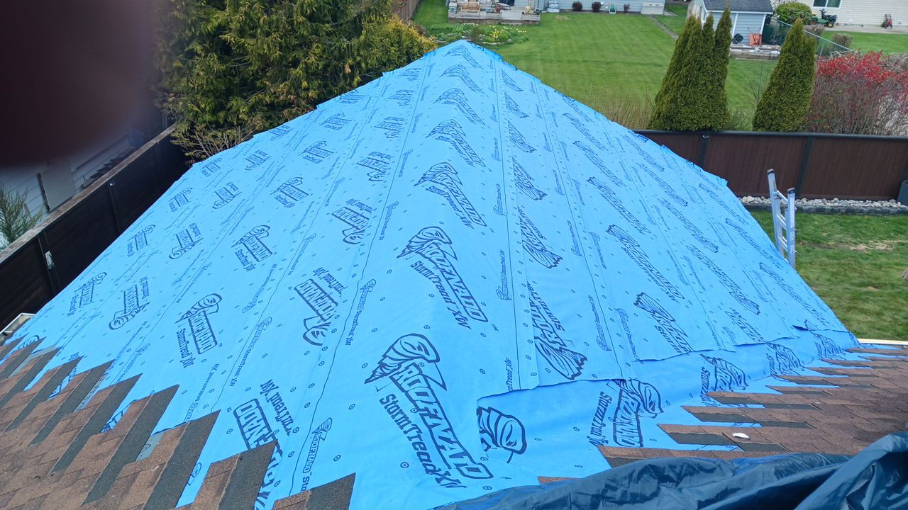 Residential patio roof extension with IKO Dual Brown shingles by Top Notch Roofing Inc