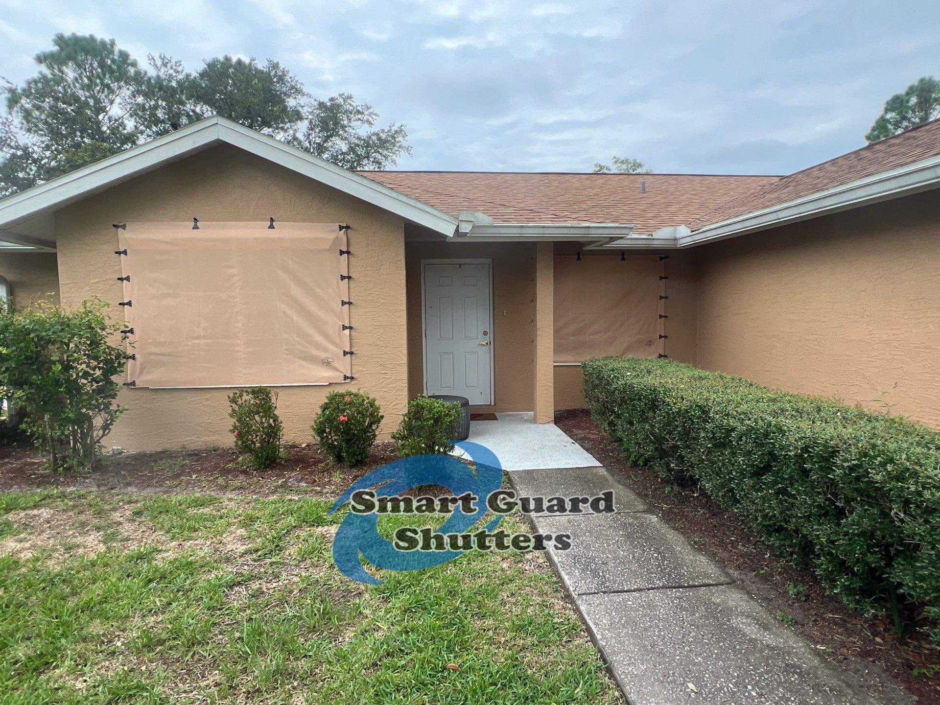 AstroGuard Hurricane Fabric in Tan by Smart Guard Shutters