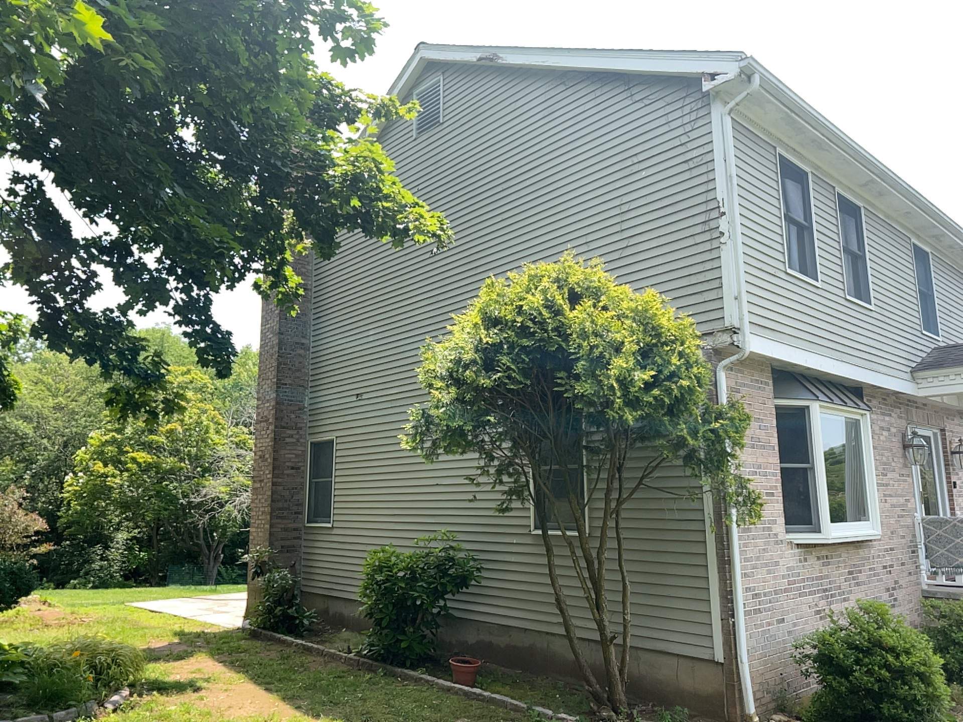 Siding Installation using Mainstreet Colonial & White gutters by A Plus Exterior
