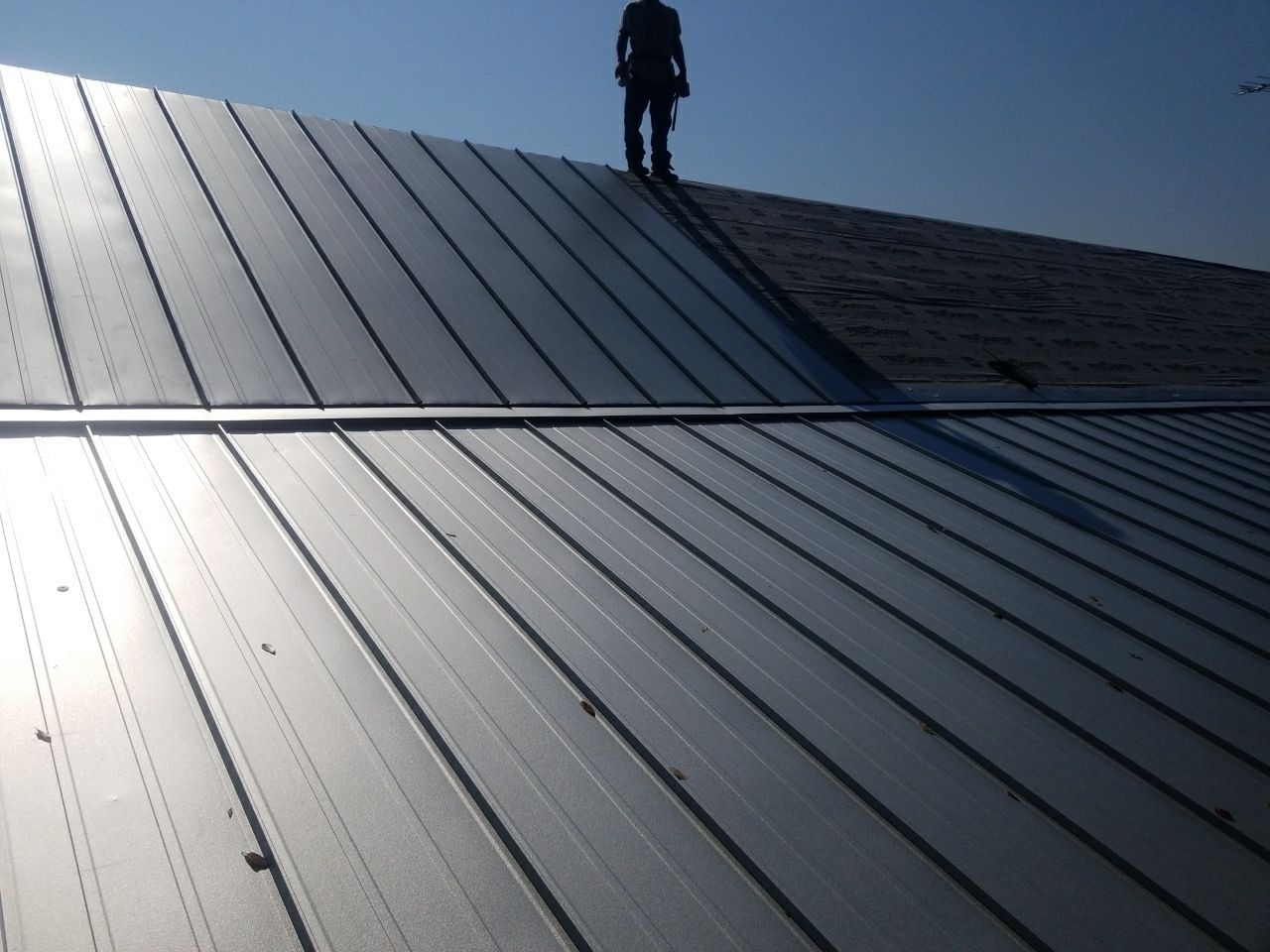 Residential Roofing Installation using Metal roofing by American Roofing & Construction LLC