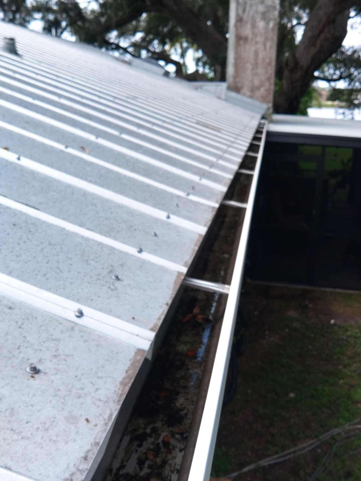 White 6-Inch Gutters and Leaf Guard Installation in Fort Myers FL by Gutter Professors