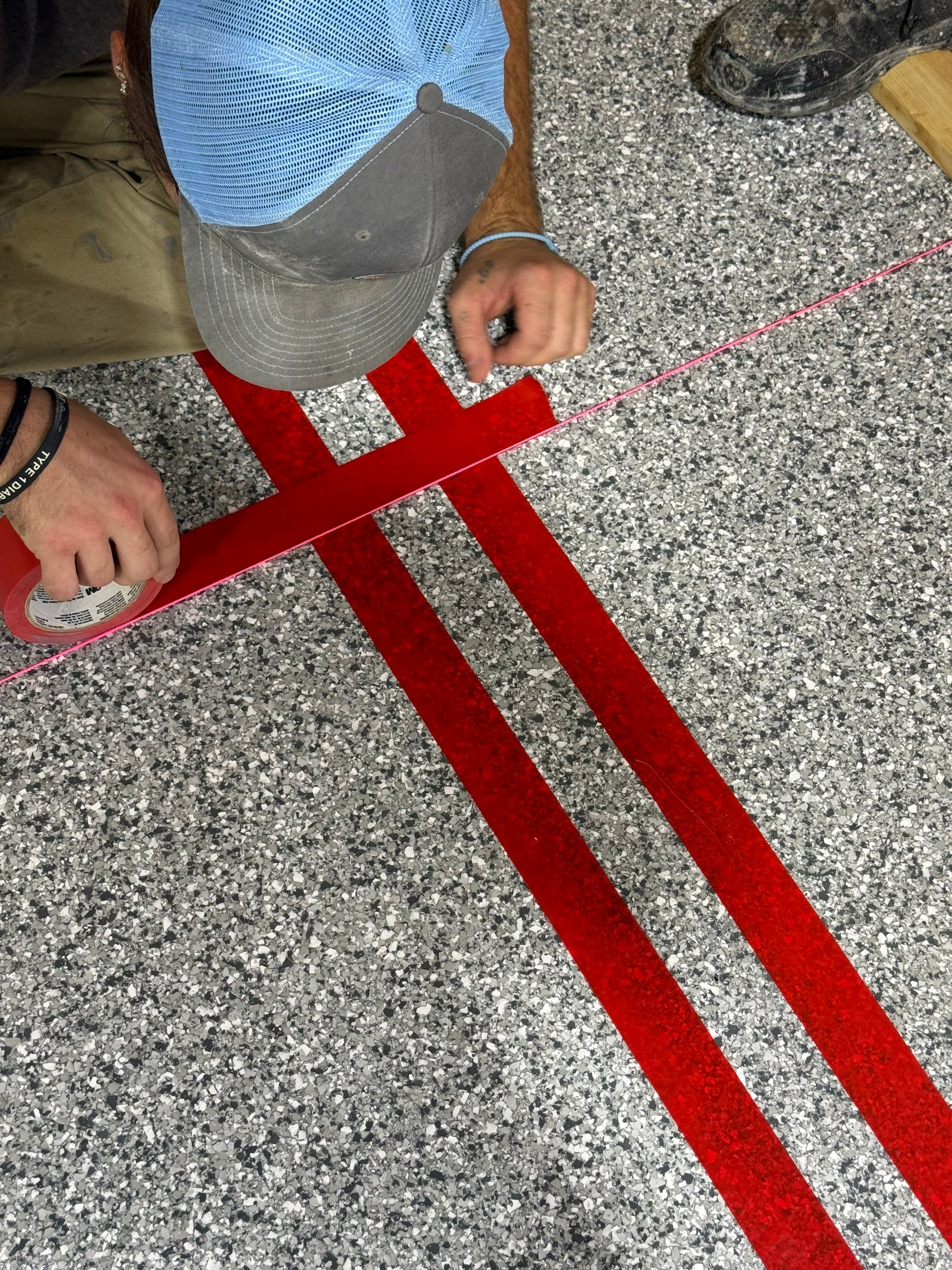 Custom Polyurea Shop Floor with Basketball Court Lines in Rock Valley by Select Painting, Coatings & Garage Cabinets