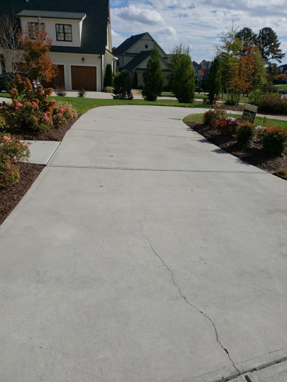 Driveway Clean using cleaner by Power Wash Masters LLC