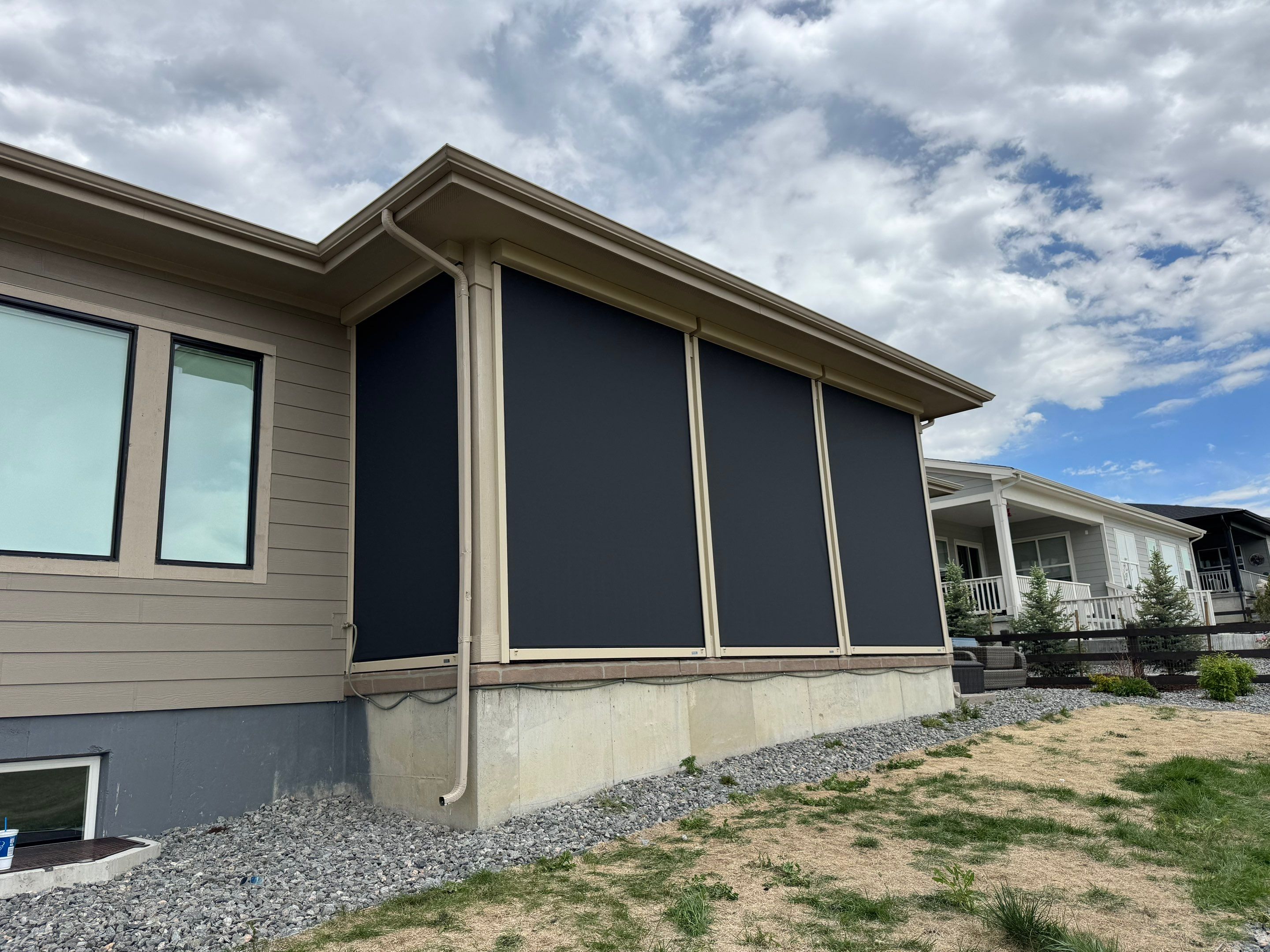 Exterior MagnaTrack Solar Screen Installation on Castle Rock Covered Patio by Outdoor Solutions Colorado