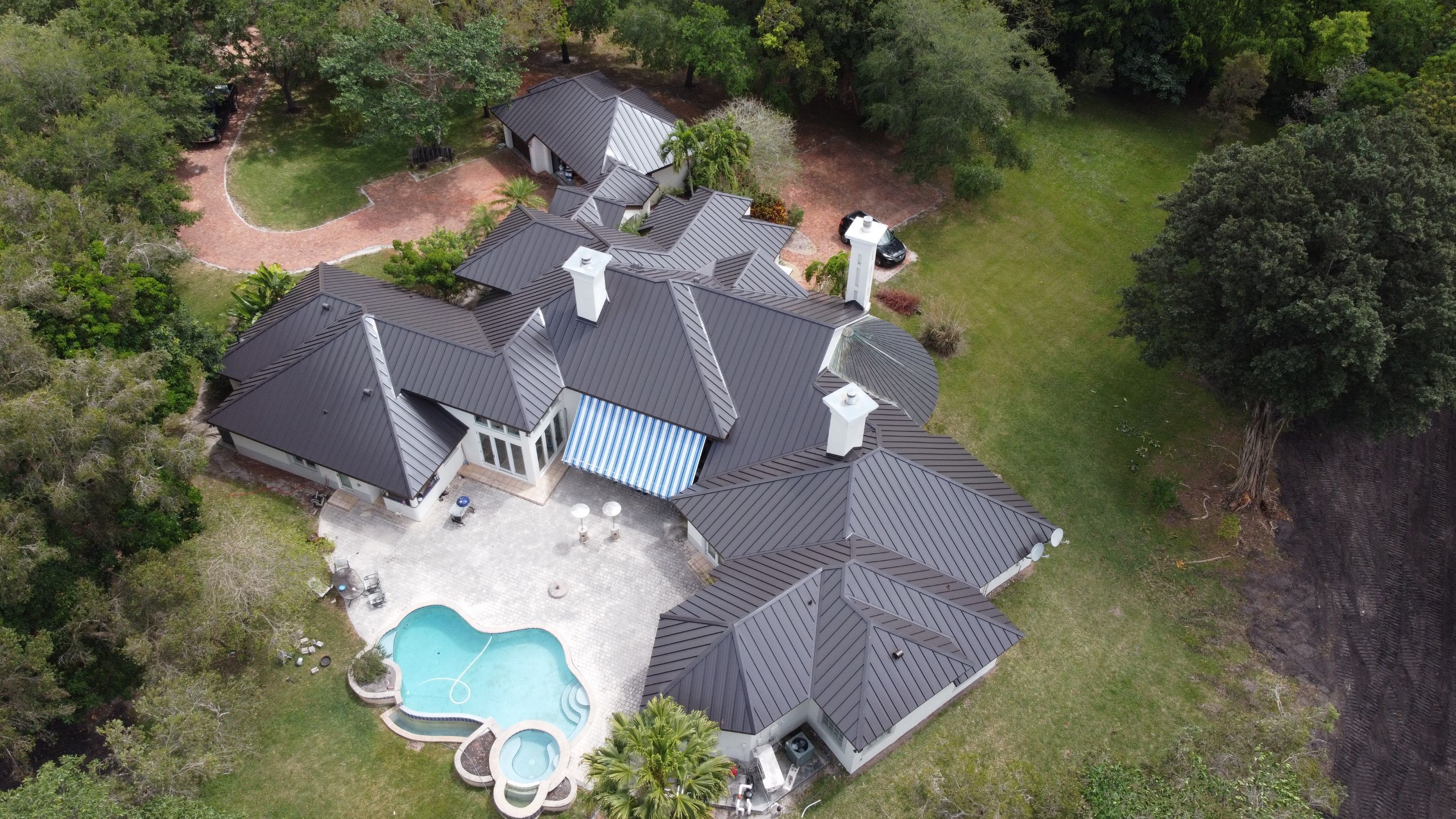 Residential Roofing Installation using 1" Nail strip metal roof by BLUES BROTHERS ROOFING