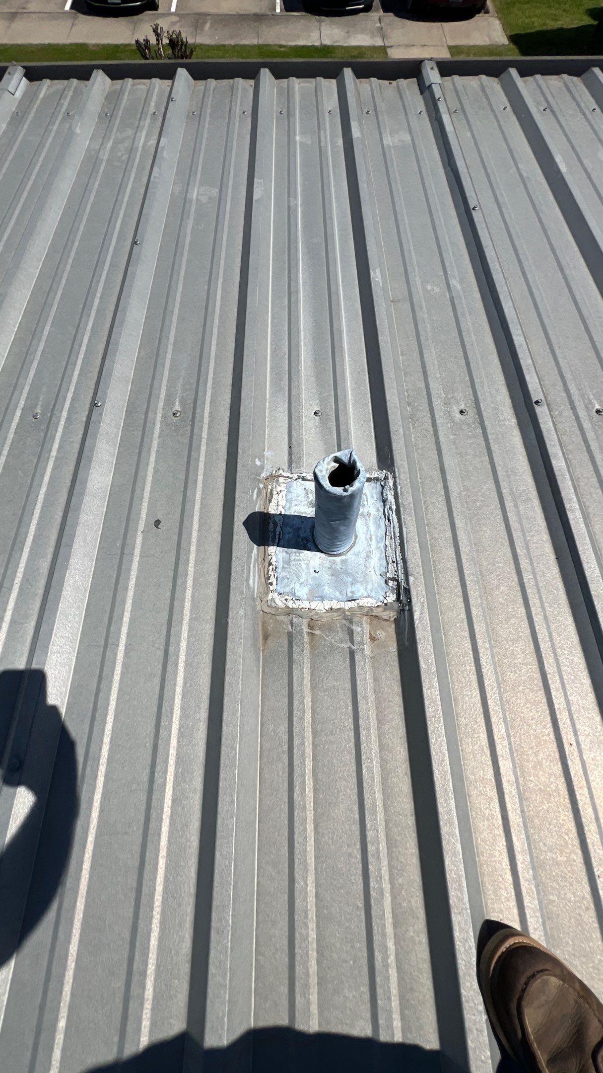 Commercial Roofing Installation using TRP #924 Eterna-Sil Premium Silicone Roof Coating by Harvey Roofing & Construction