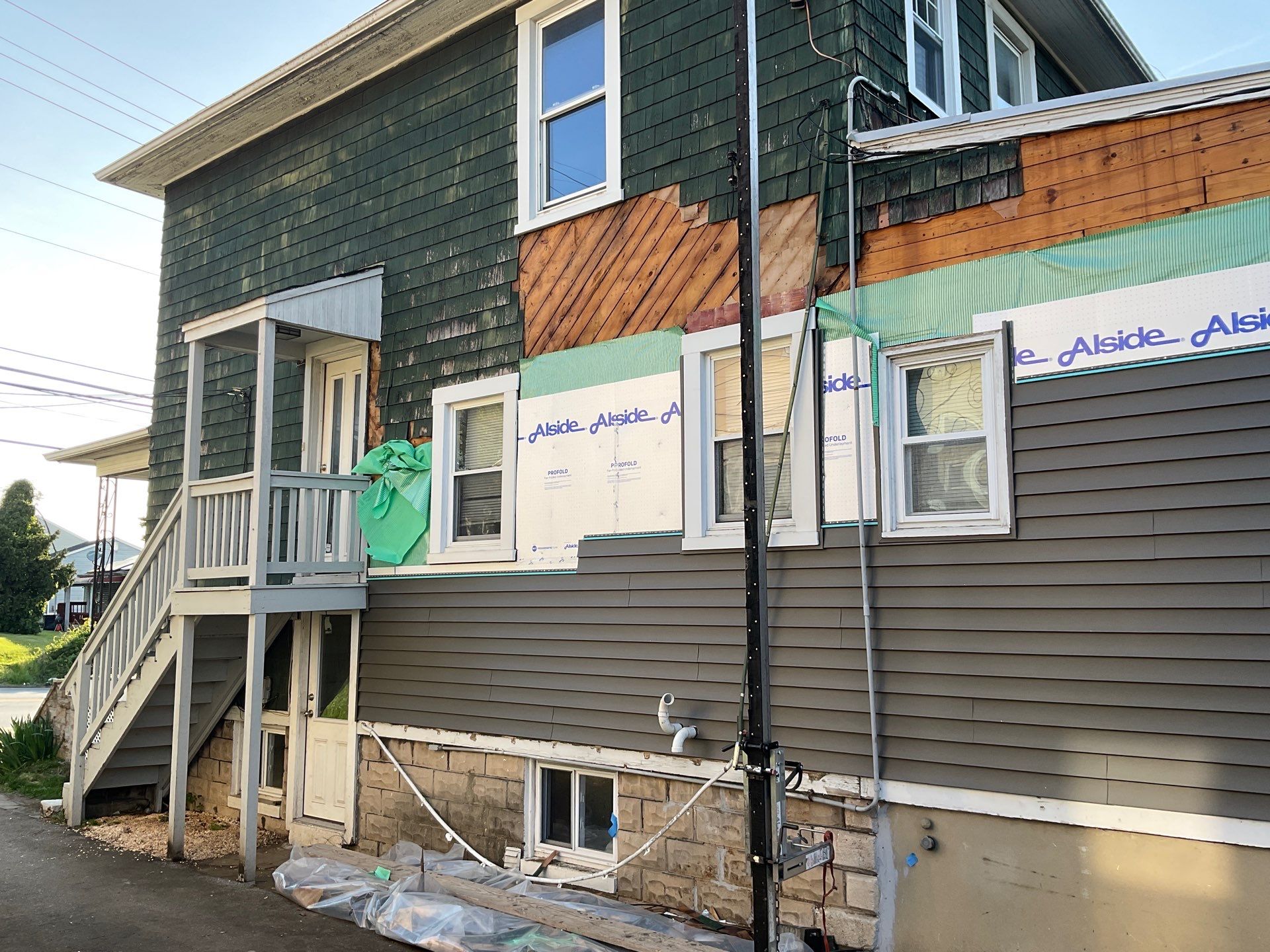 New siding & New Gutters by Alpha Design Services